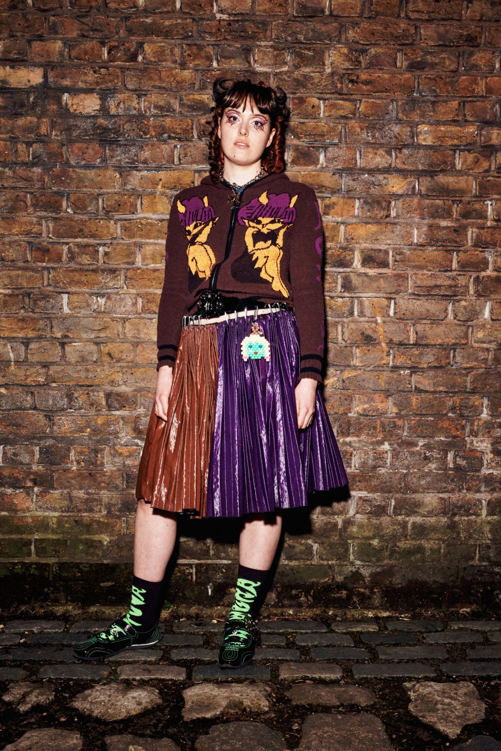 brown embroidered sweater with pleated skirt