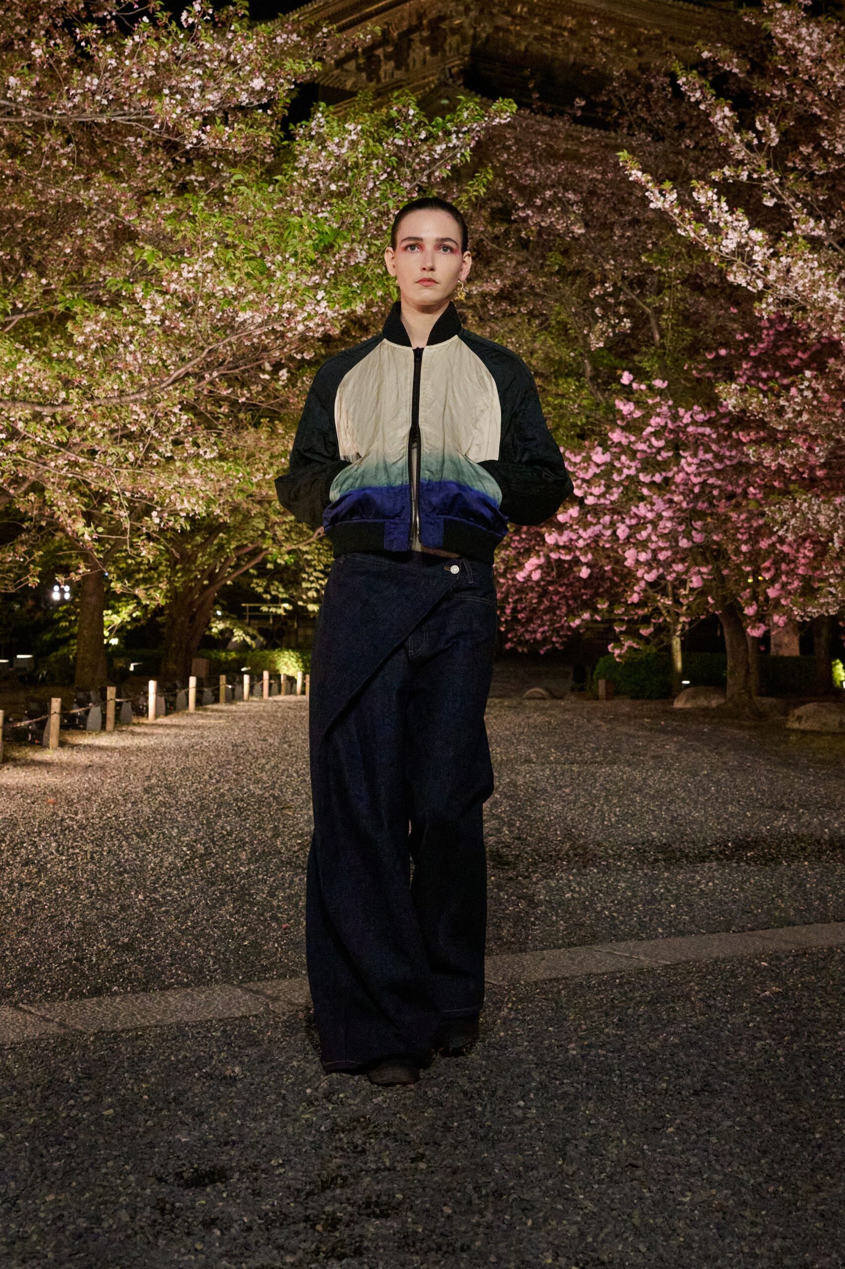 black and beige color-blocked jacket with relaxed denim pants