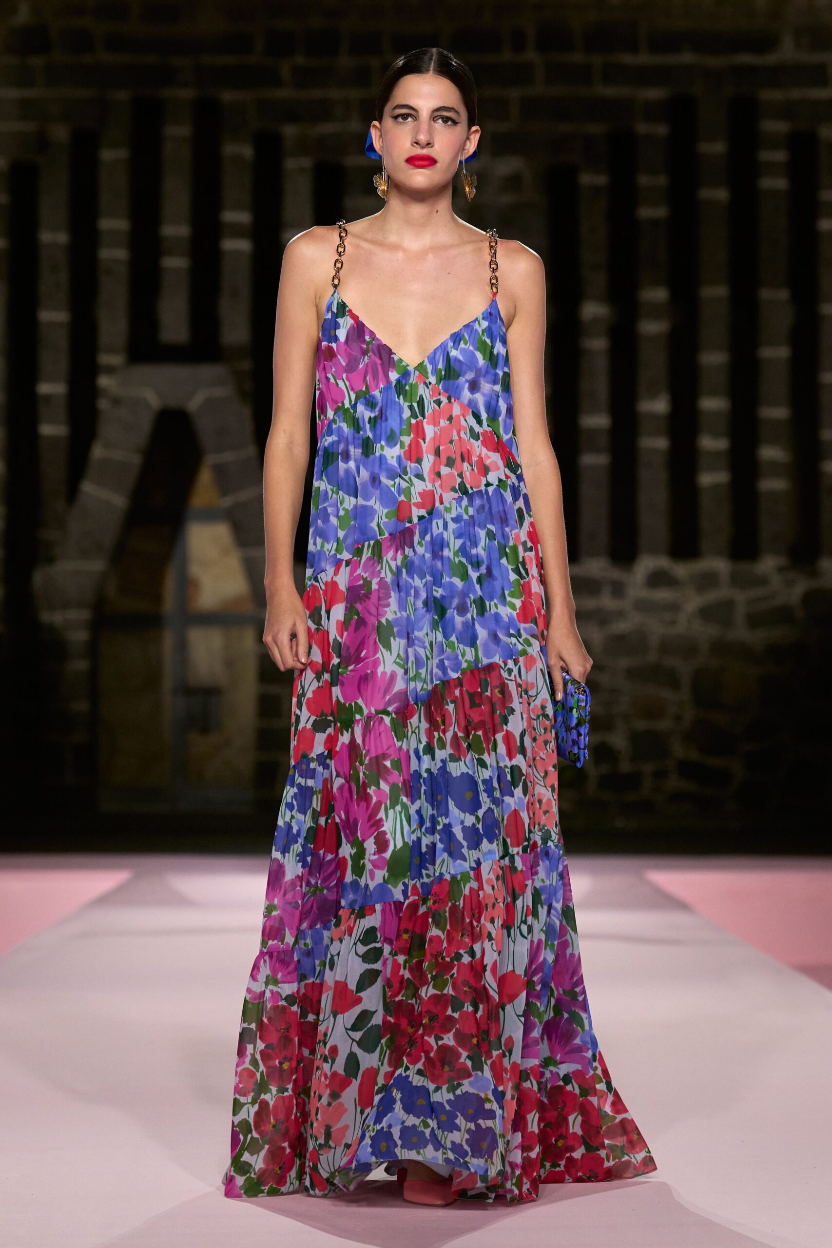 floral maxi gown with blue bag
