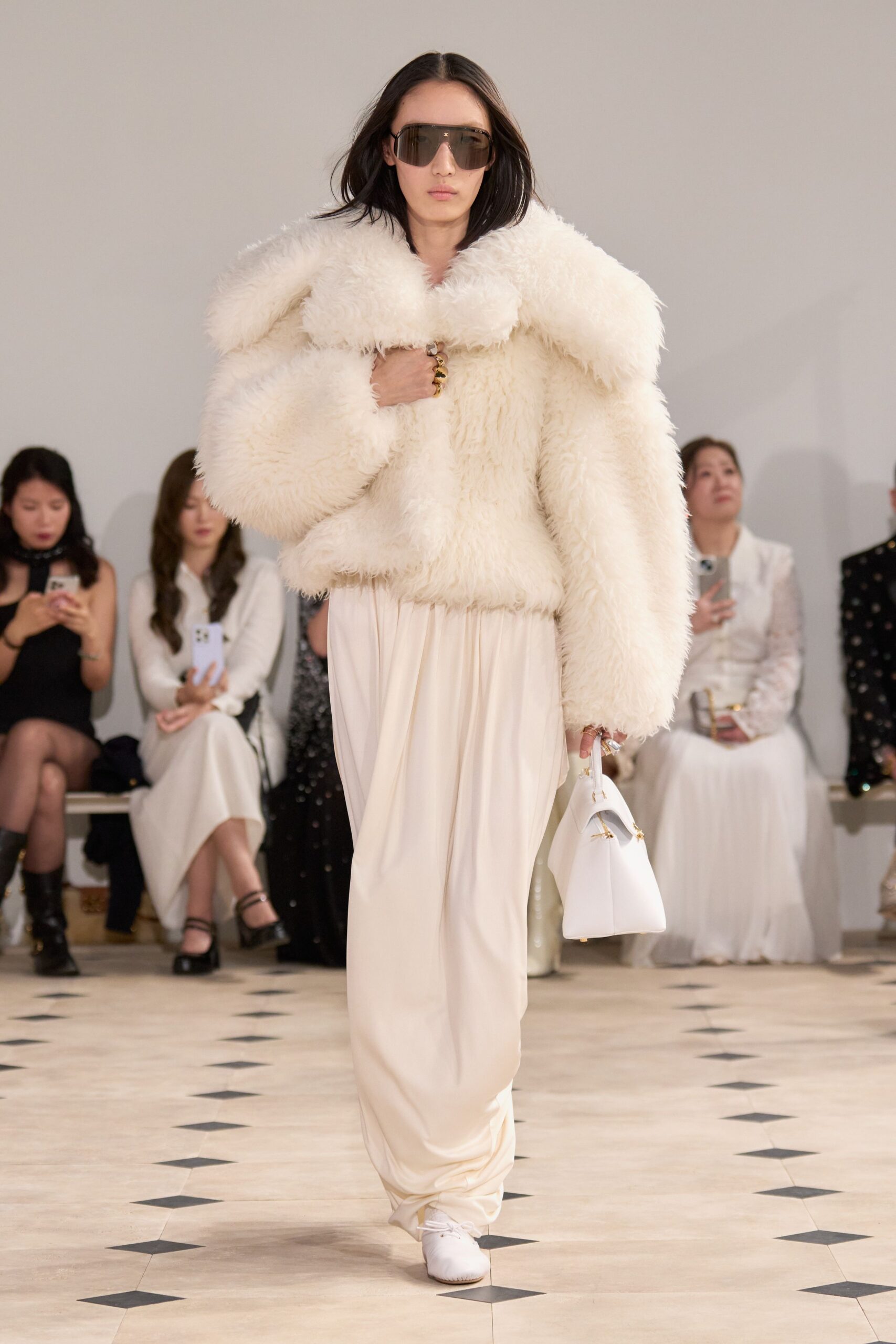 white fur coat with draped pants