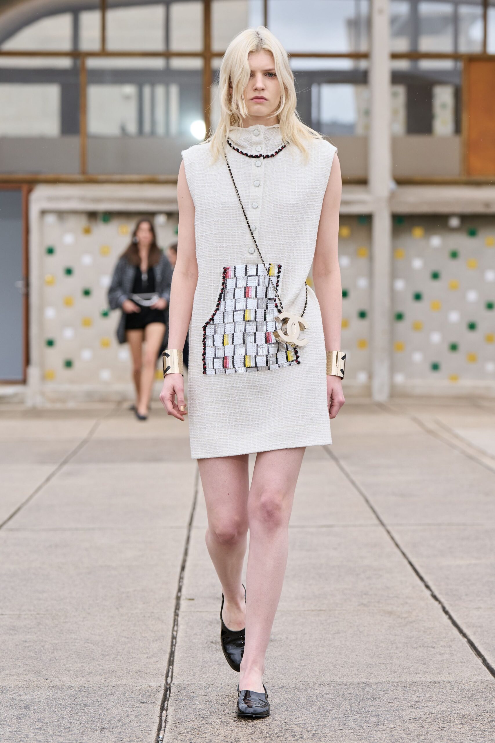 white cotton sleeveless collared fitted buttoned pockets dress