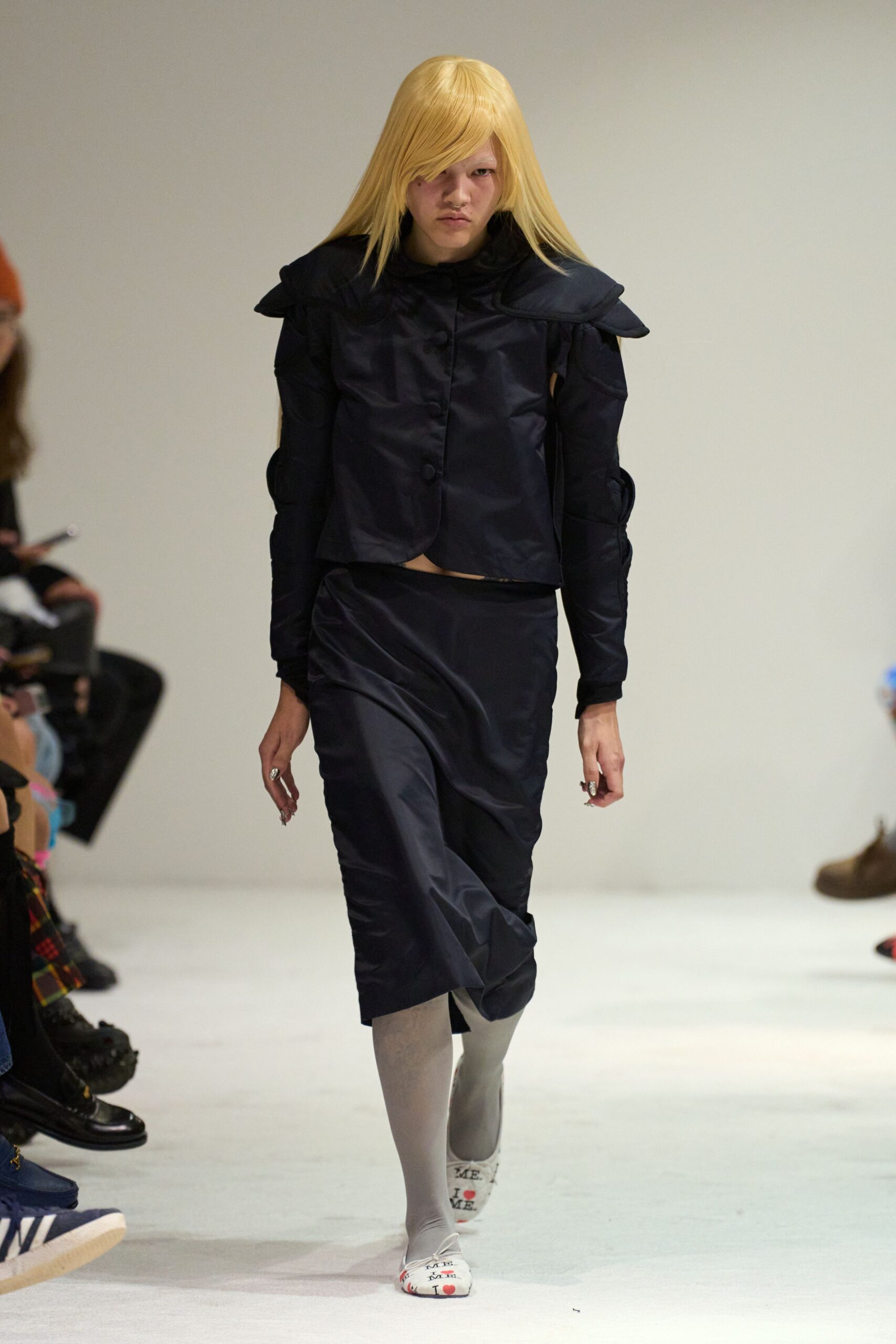 black silk fitted jacket and skirt