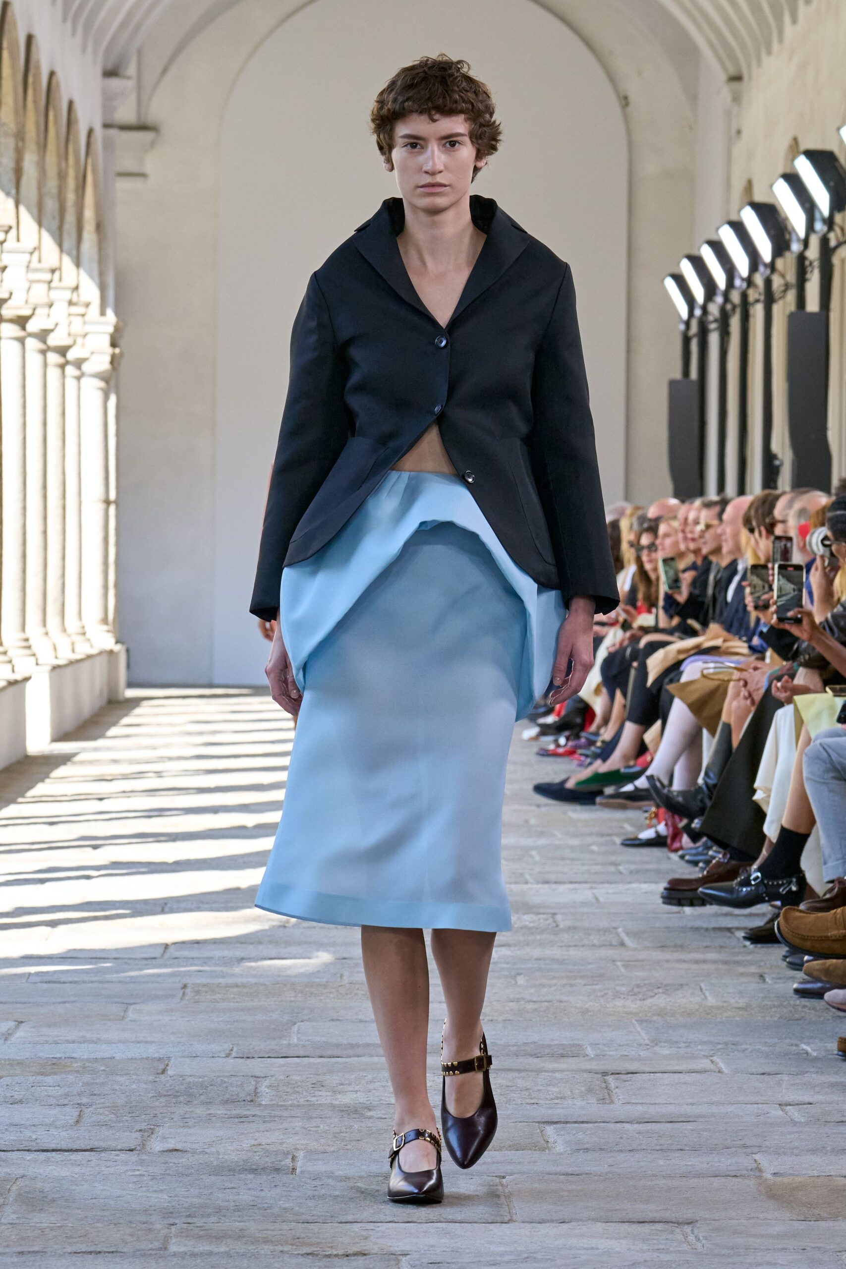 black jacket blue midi skirt