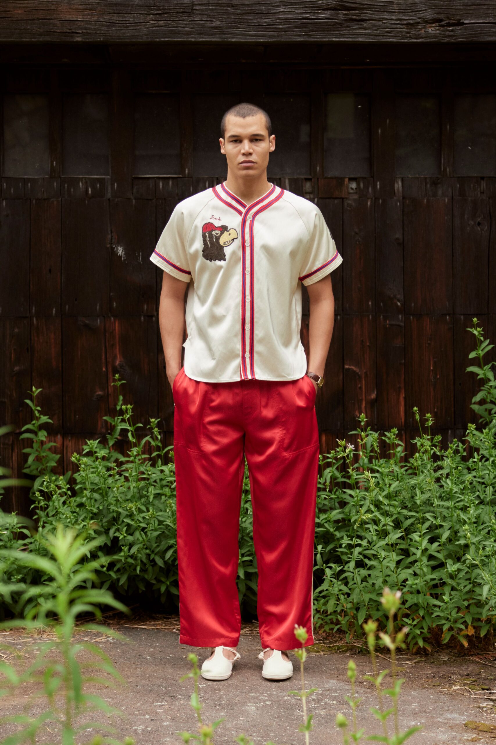 white collared shirt red pants