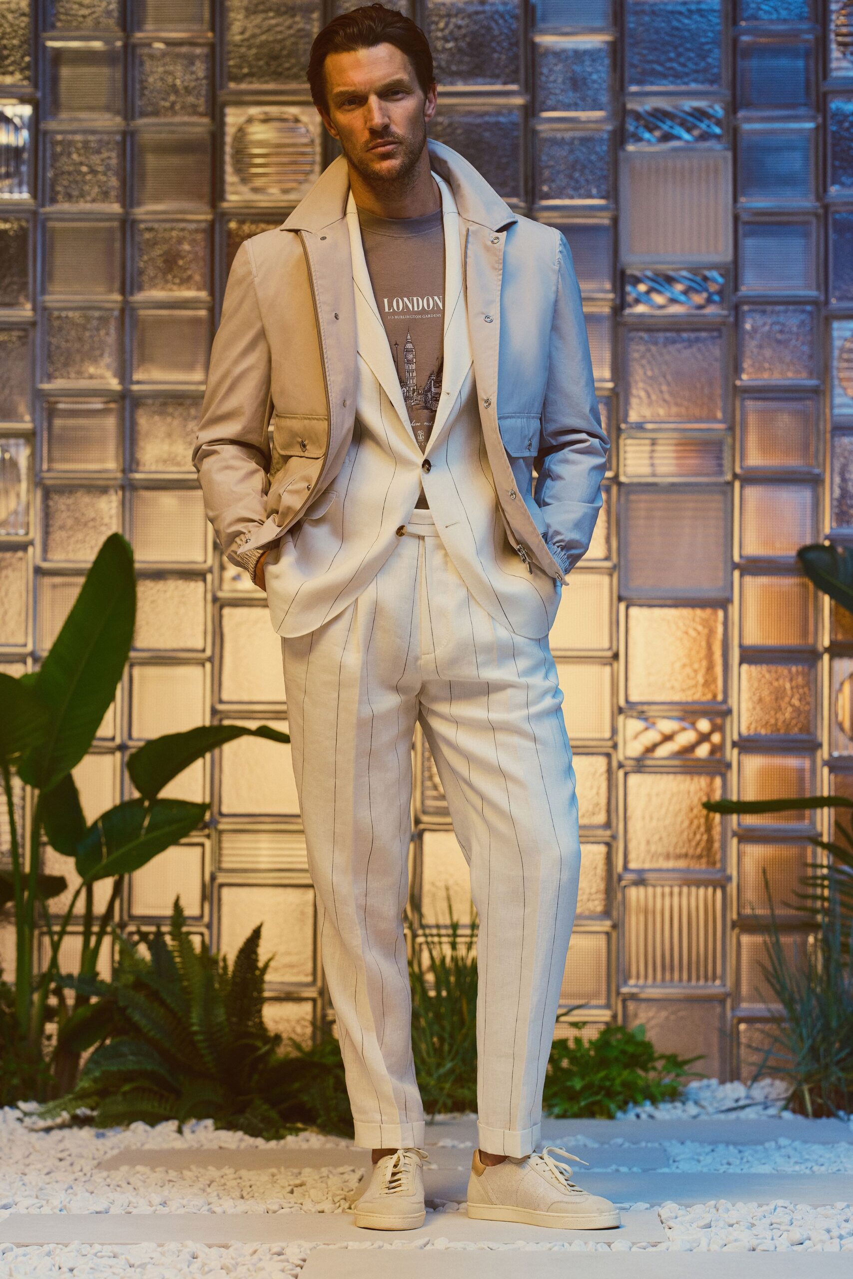 beige tailored suit with gray t-shirt