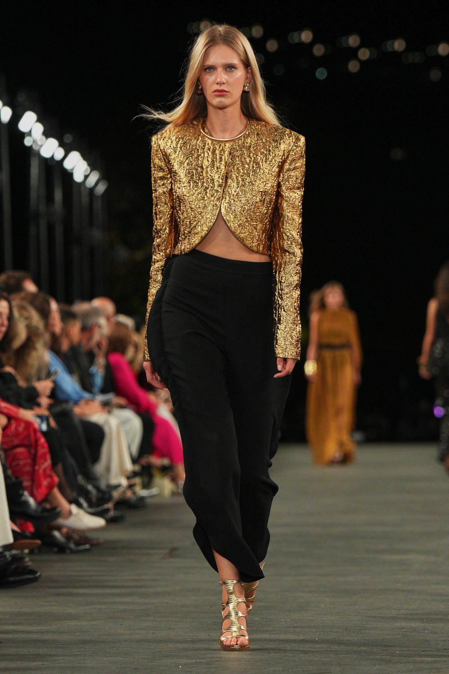 gold metallic jacket black skirt