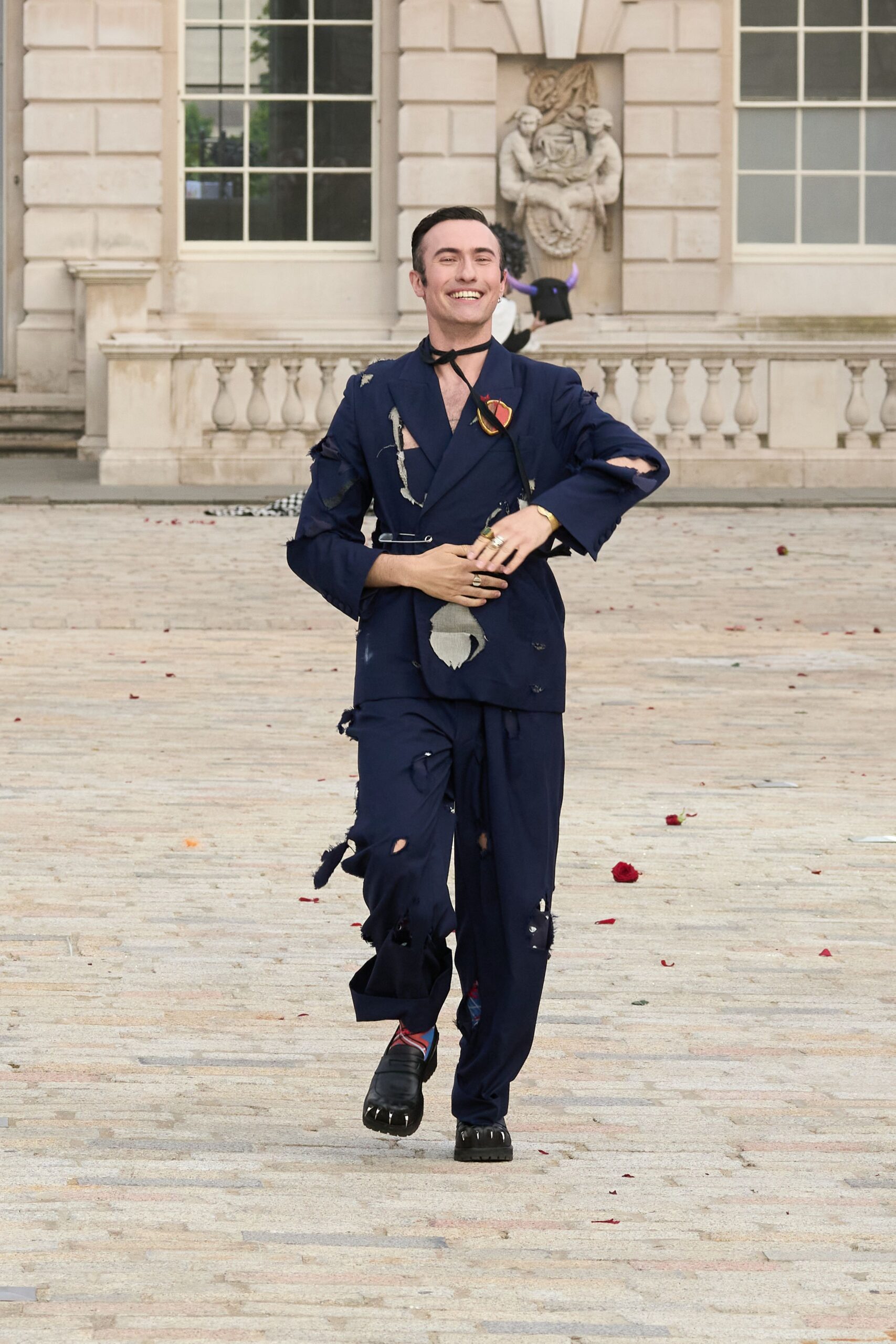 blue distressed suit with black shoes