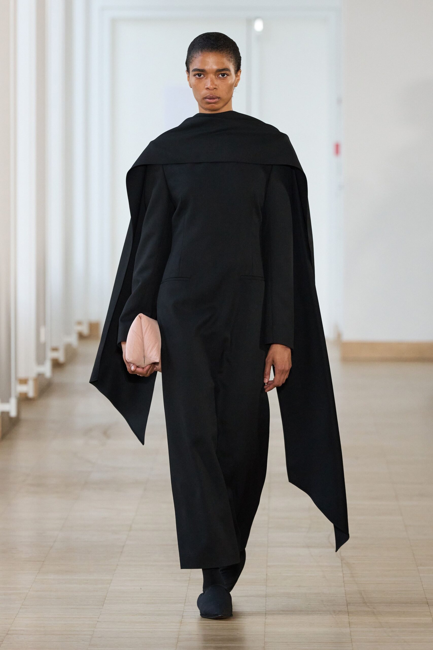 black fitted jumpsuit with cape