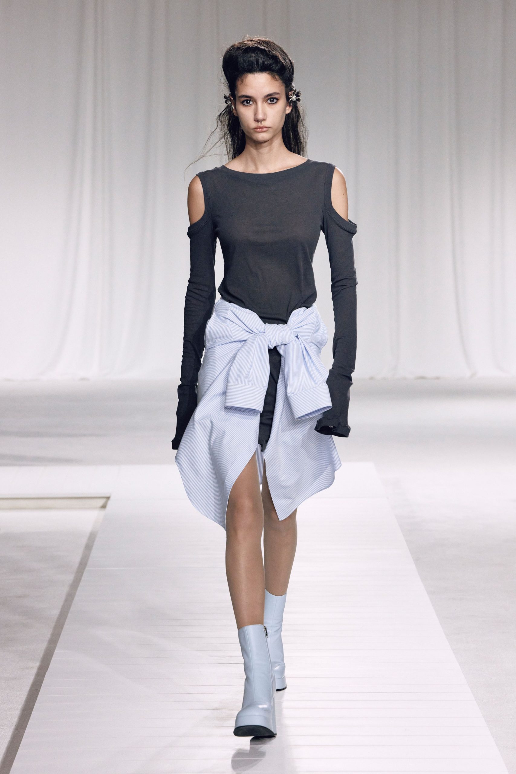 black top blue skirt white boots