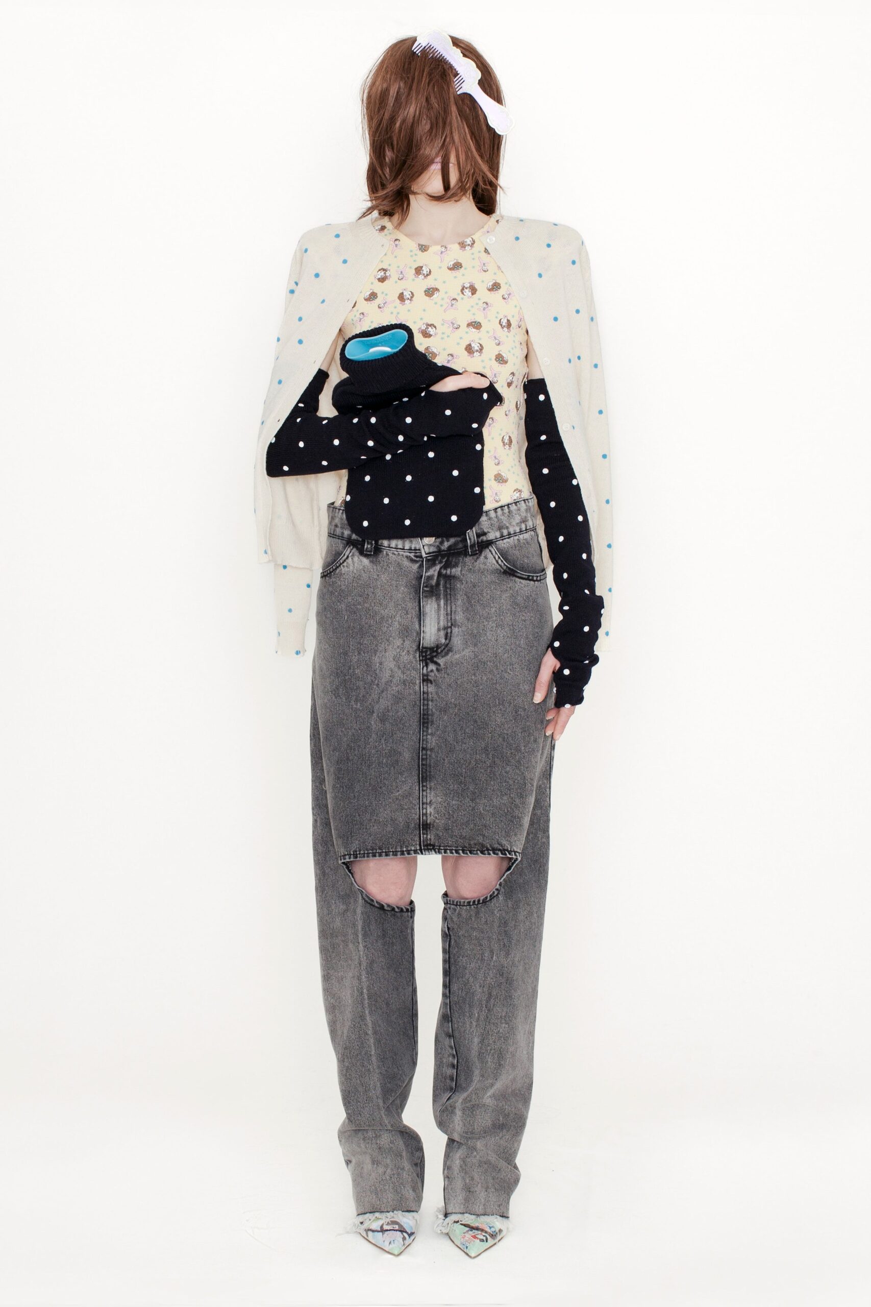 beige printed top with black sweater