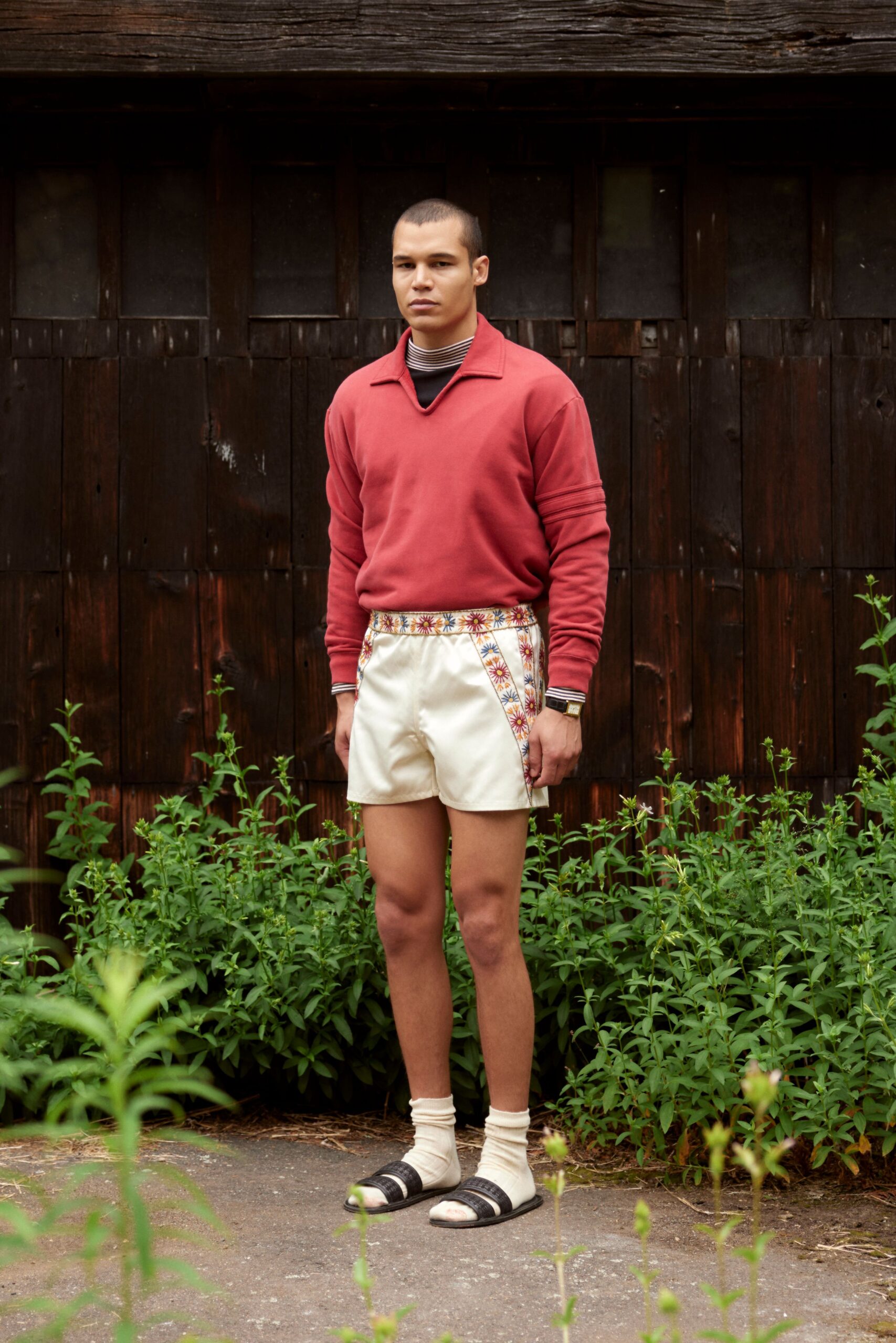 red relaxed sweater with white shorts
