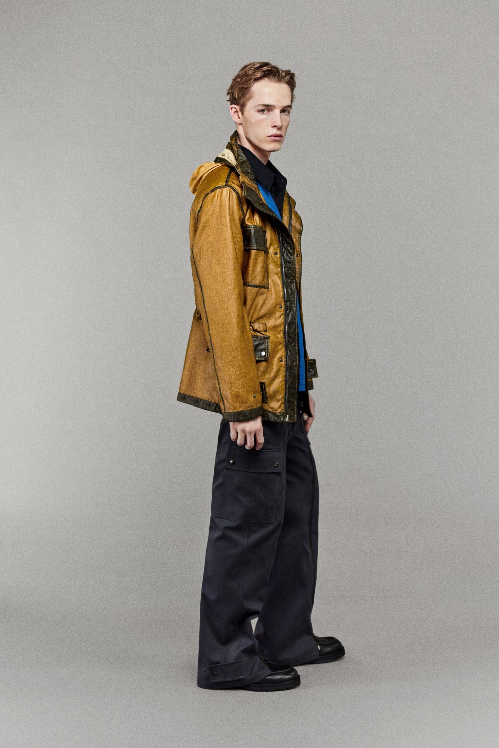 yellow jacket blue shirt black pants