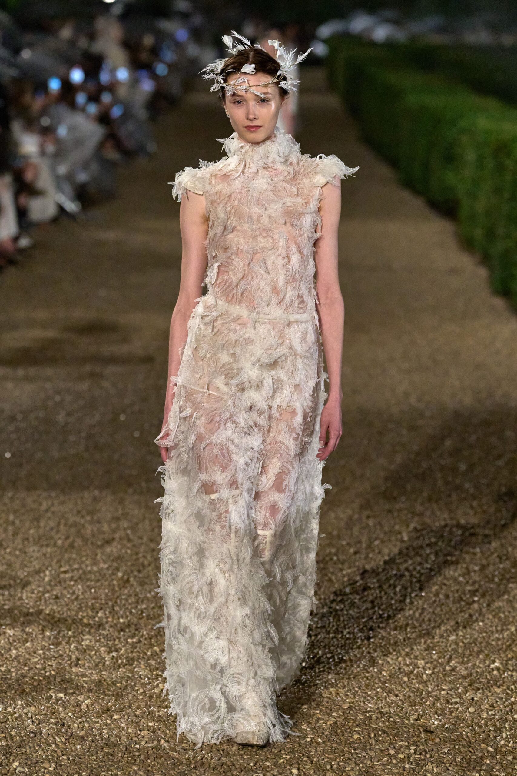 white feathered sleeveless gown