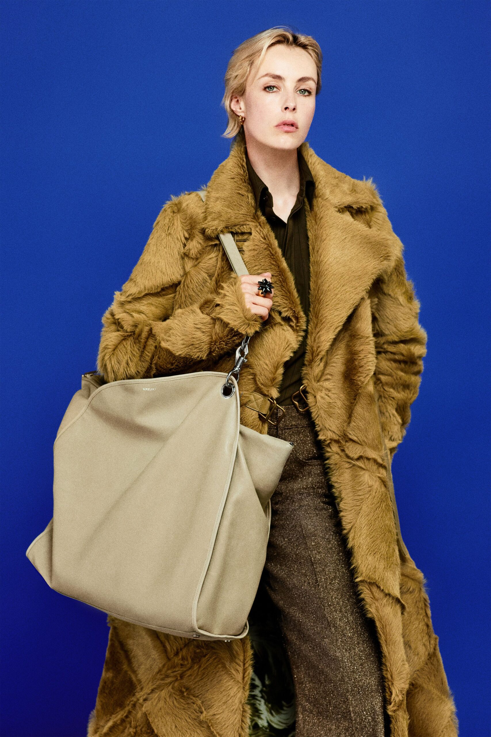 brown faux-fur coat with black shirt
