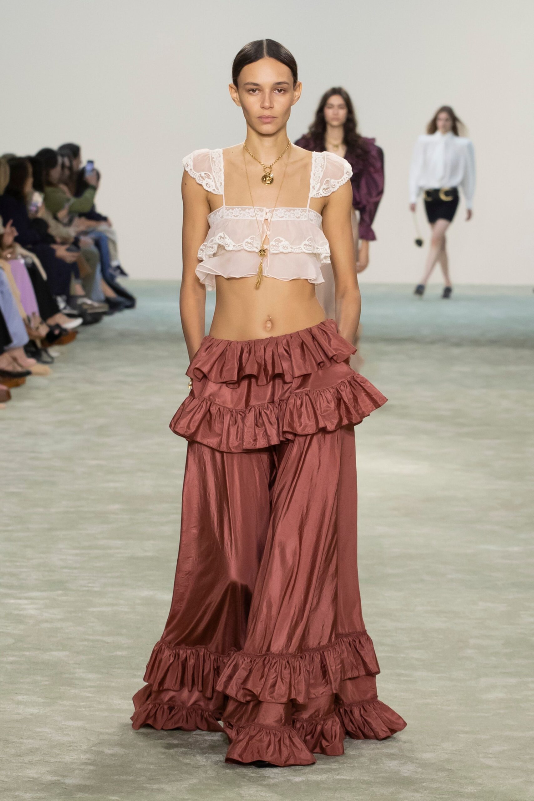 white ruffled top and brown tiered skirt