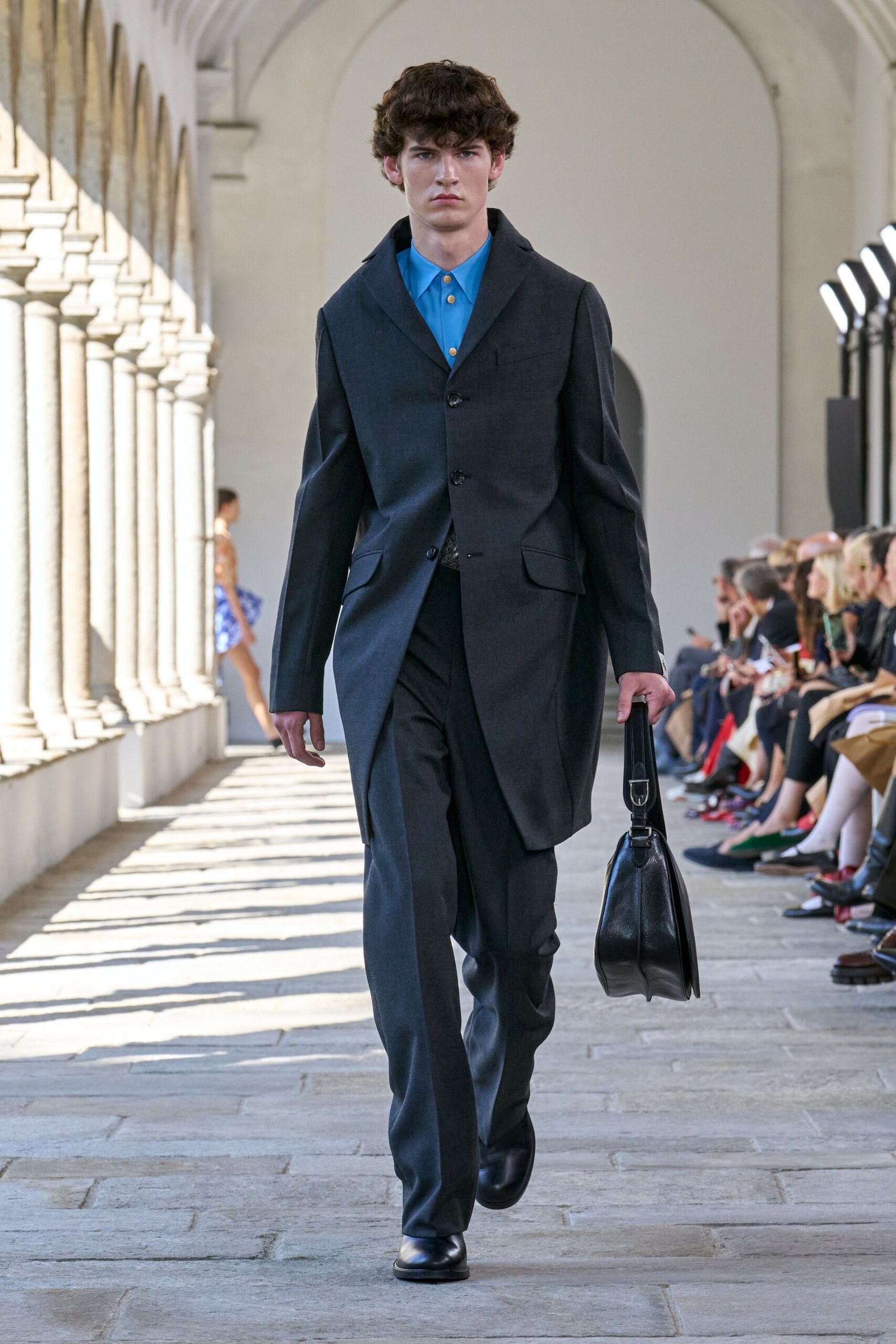 black wool coat blue shirt tailored pants