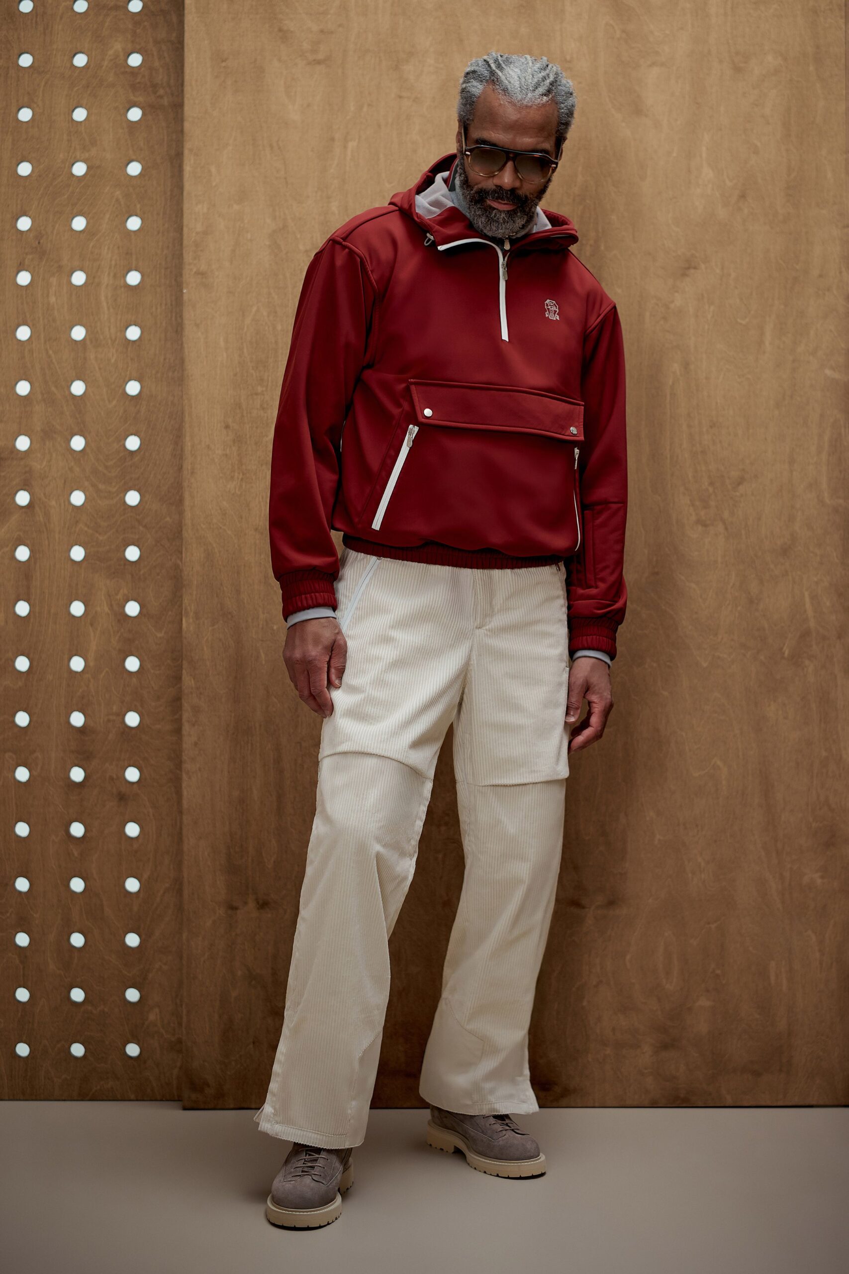 red relaxed jacket with beige pants