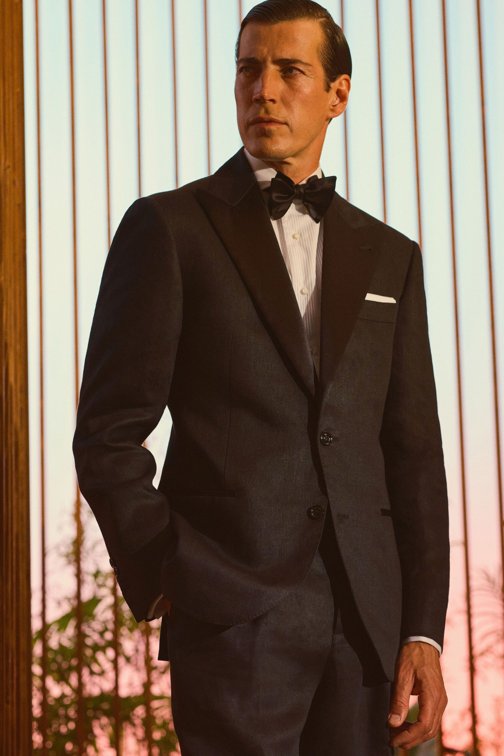 black tailored suit with bow tie
