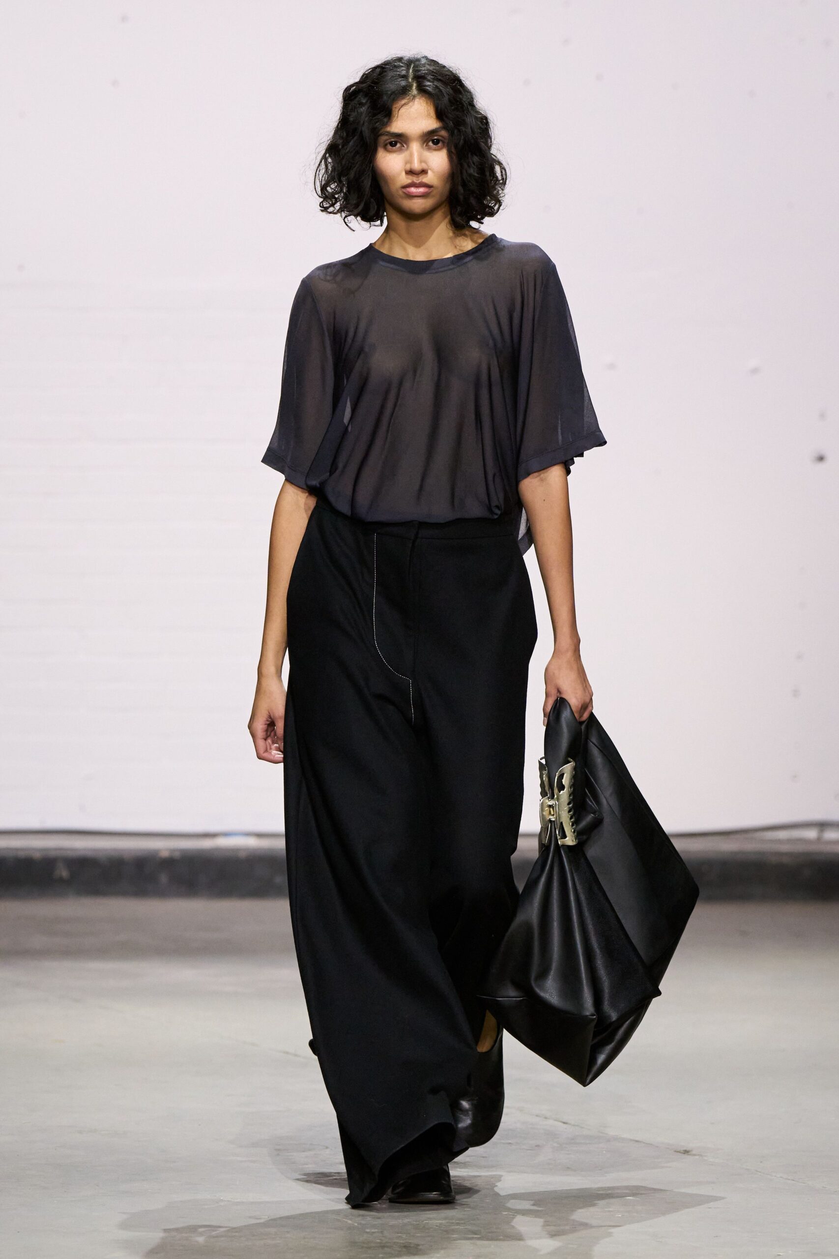black sheer top with wide-leg pants