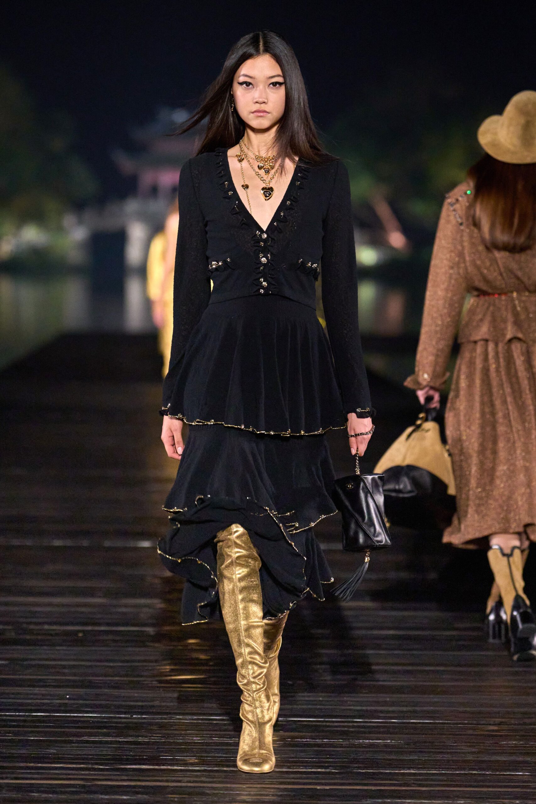 black midi dress with gold boots