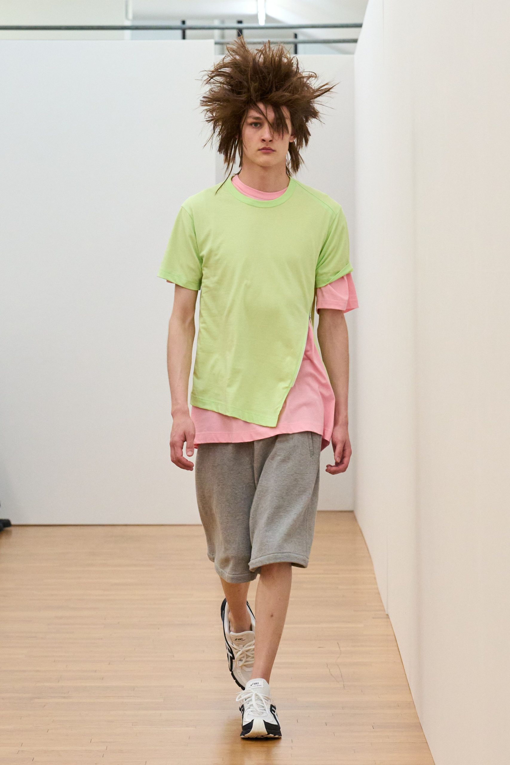 green and pink relaxed t-shirt with gray shorts