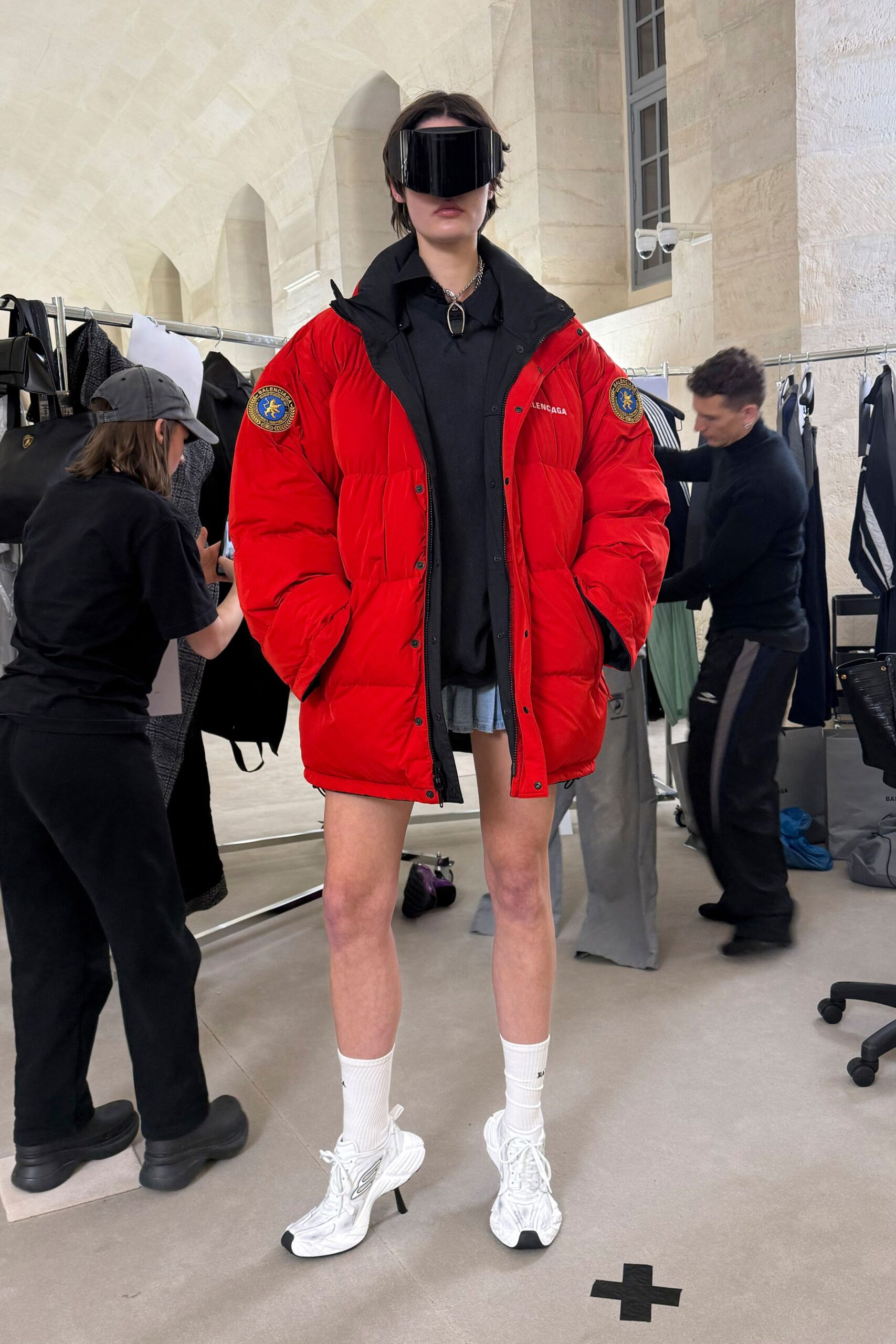 red oversized coat with black hoodie
