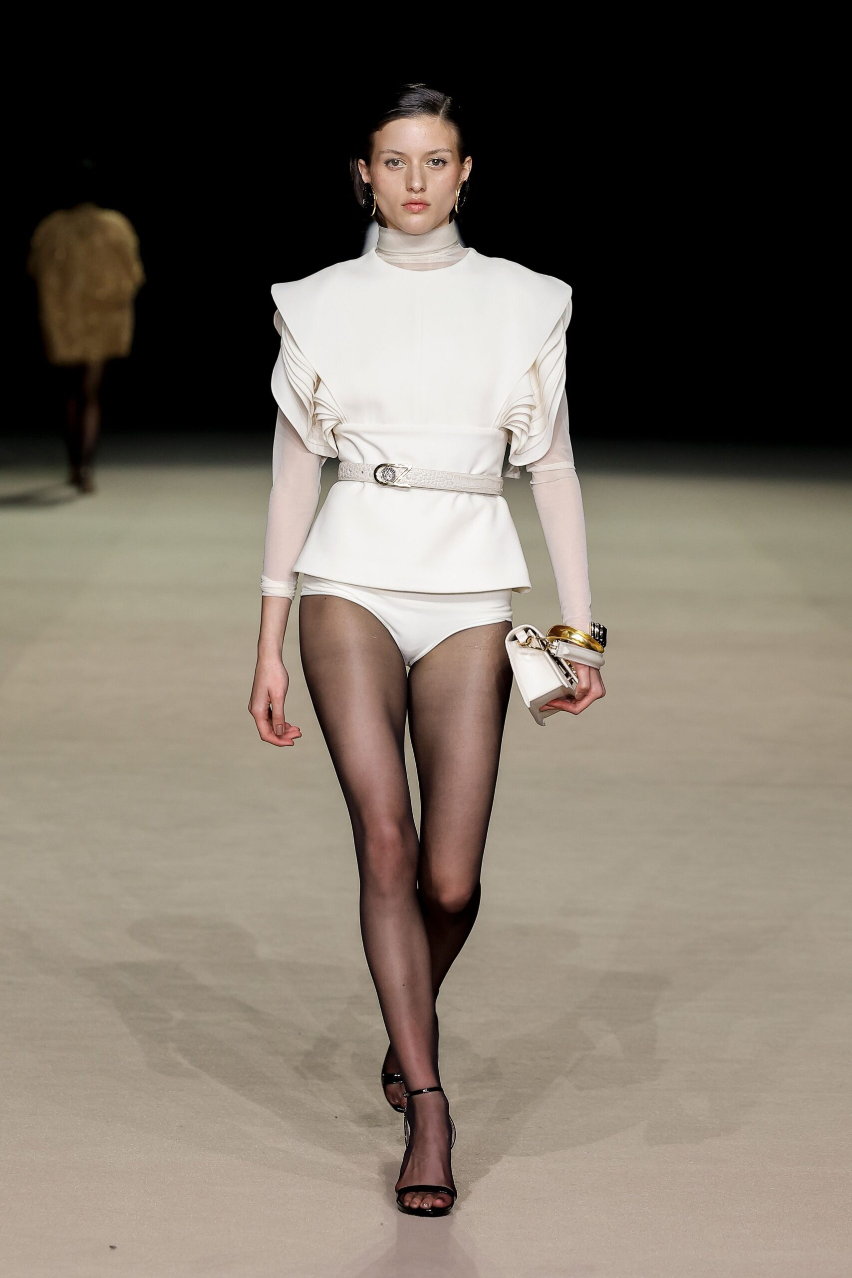 white ruffled bodysuit with black shoes