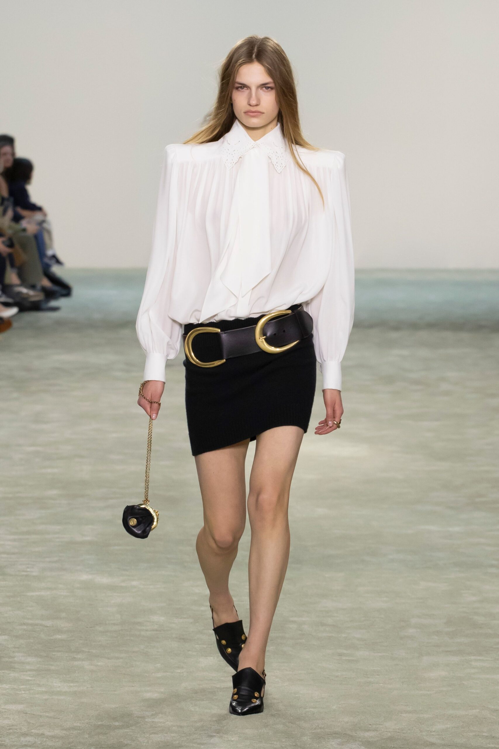white pleated blouse with black skirt