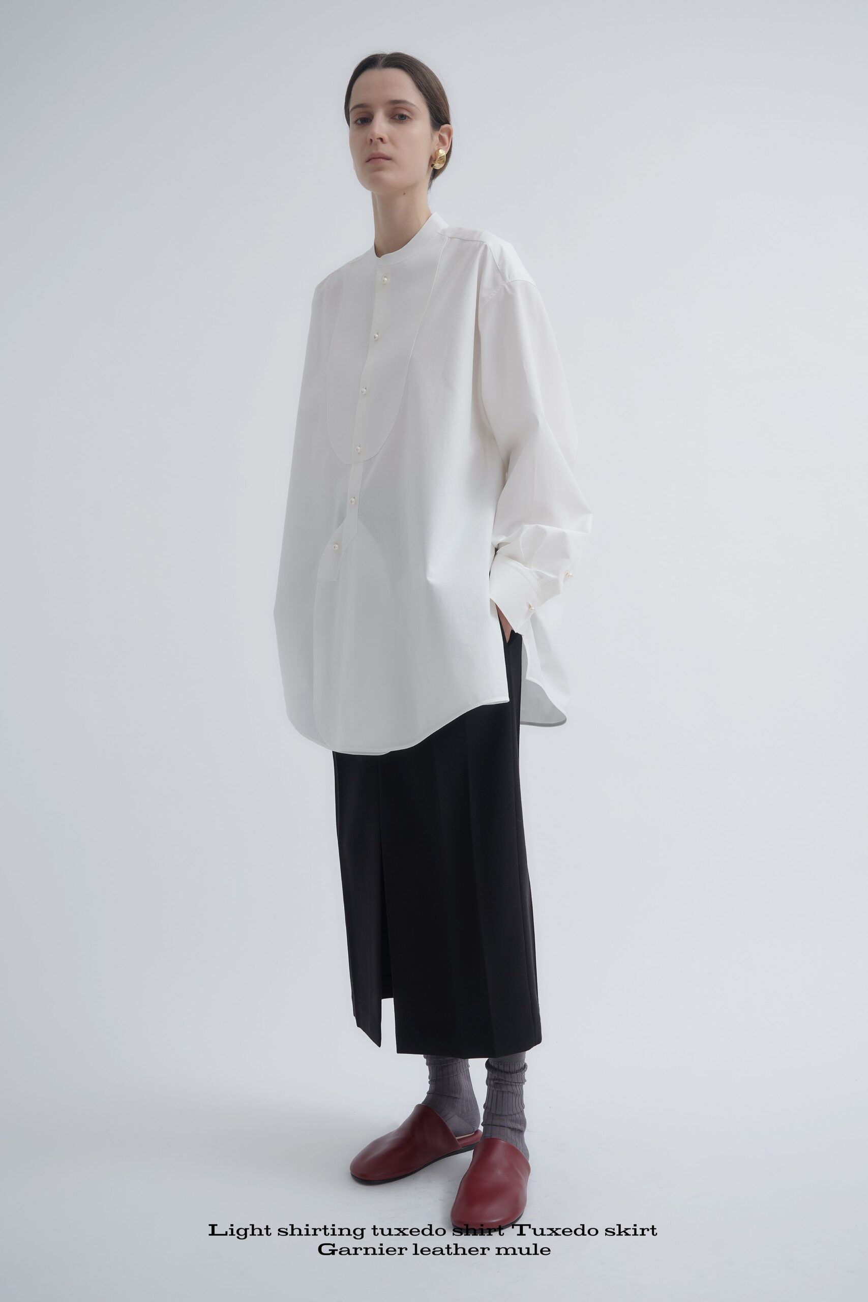 oversized white shirt black skirt red shoes