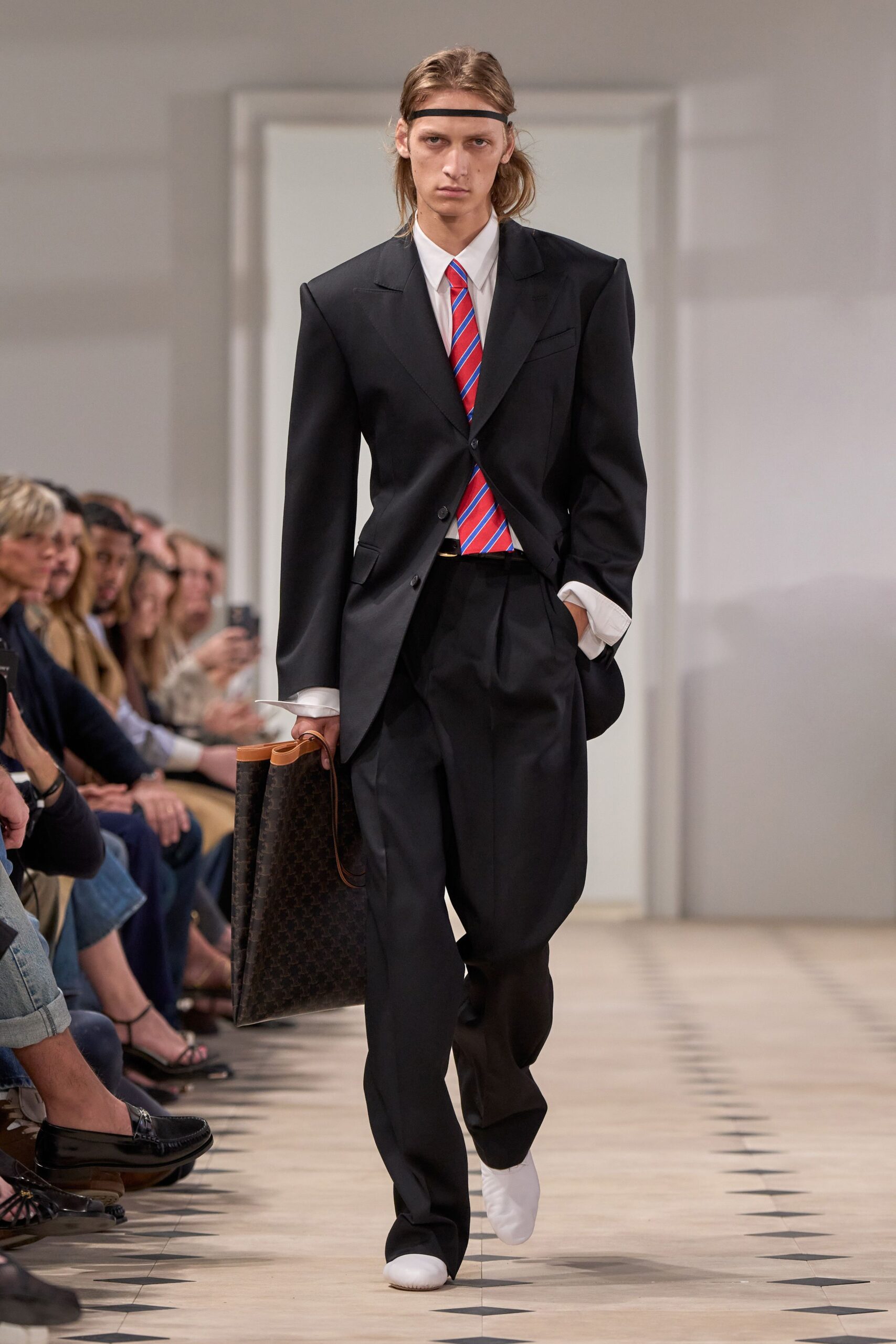 black suit with striped tie
