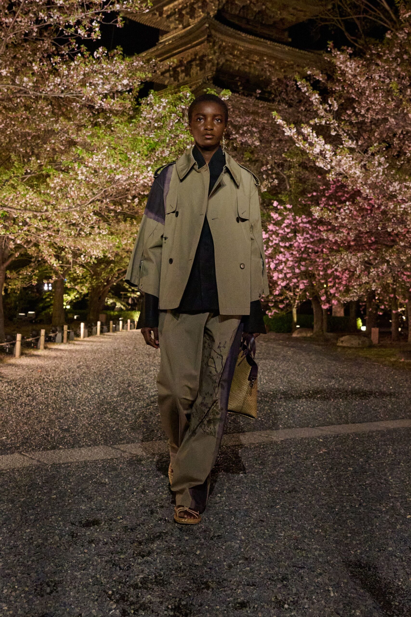 beige jacket black shirt relaxed pants