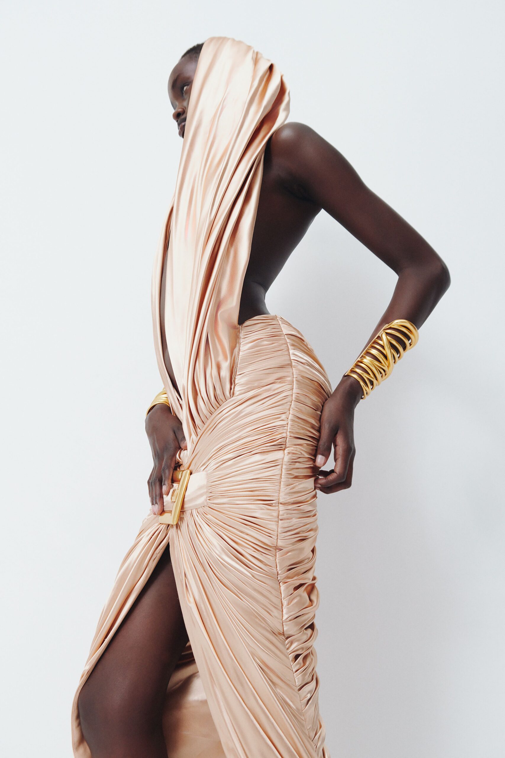 beige satin sleeveless high-neck fitted ruched draped gown