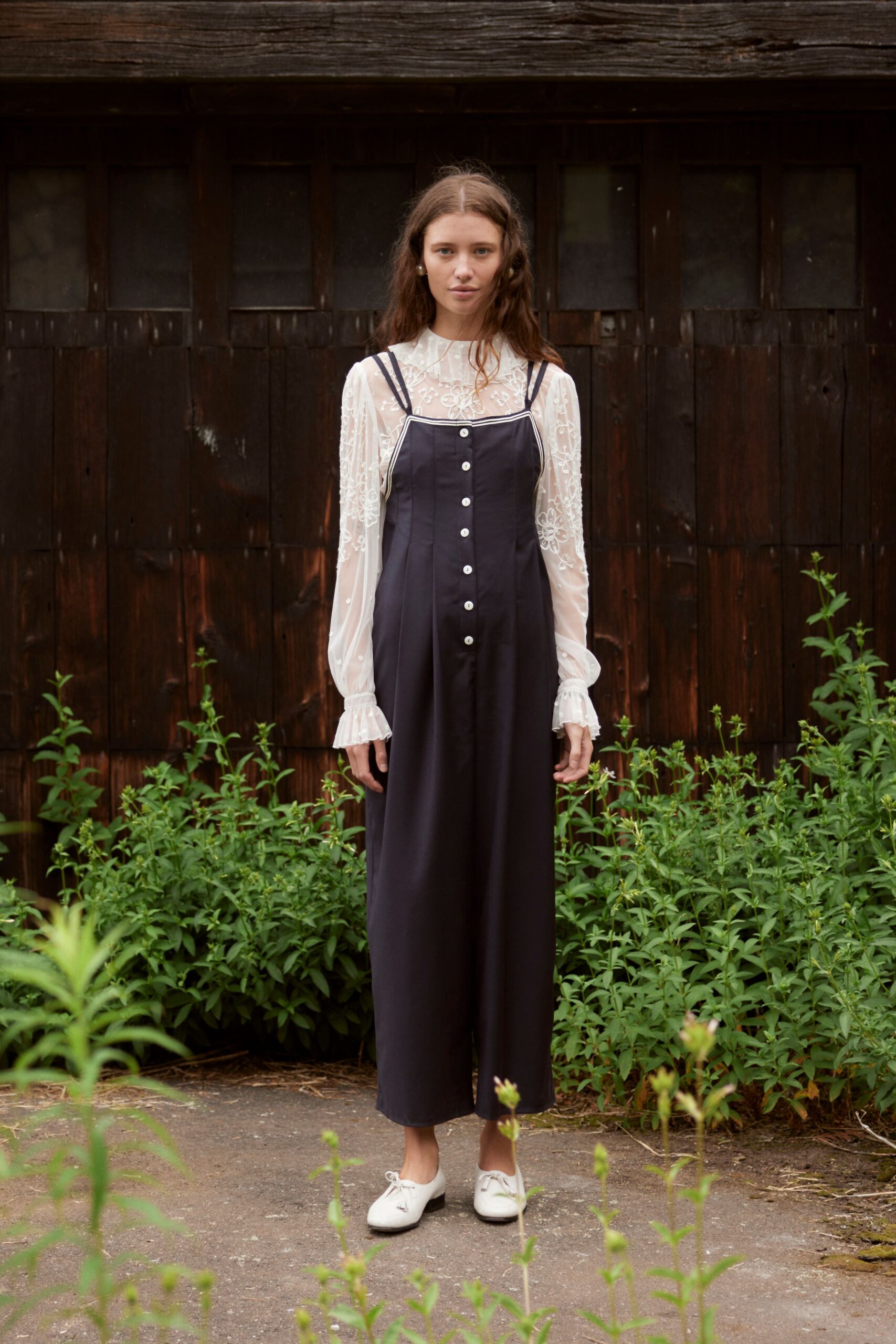 black cotton sleeveless v-neck relaxed buttoned jumpsuit