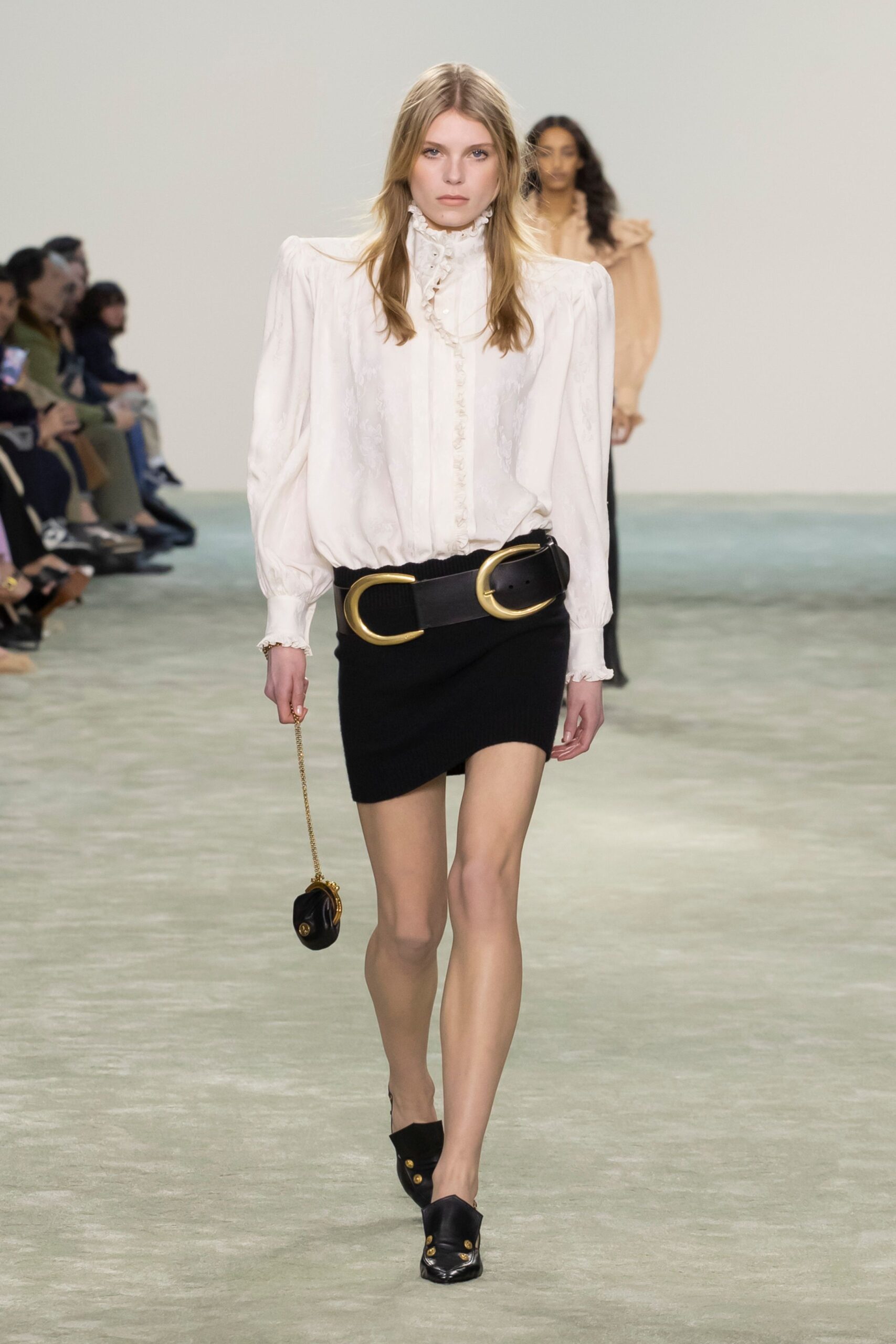 white silk blouse and black mini skirt