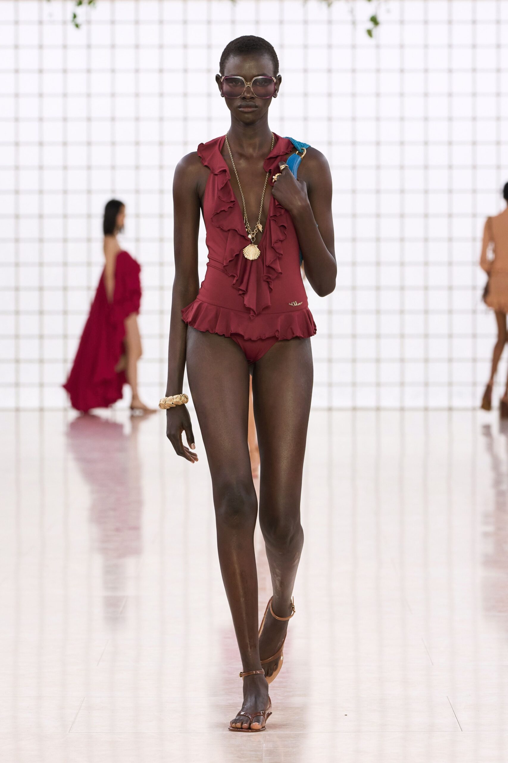 red ruffled swimsuit with sandals