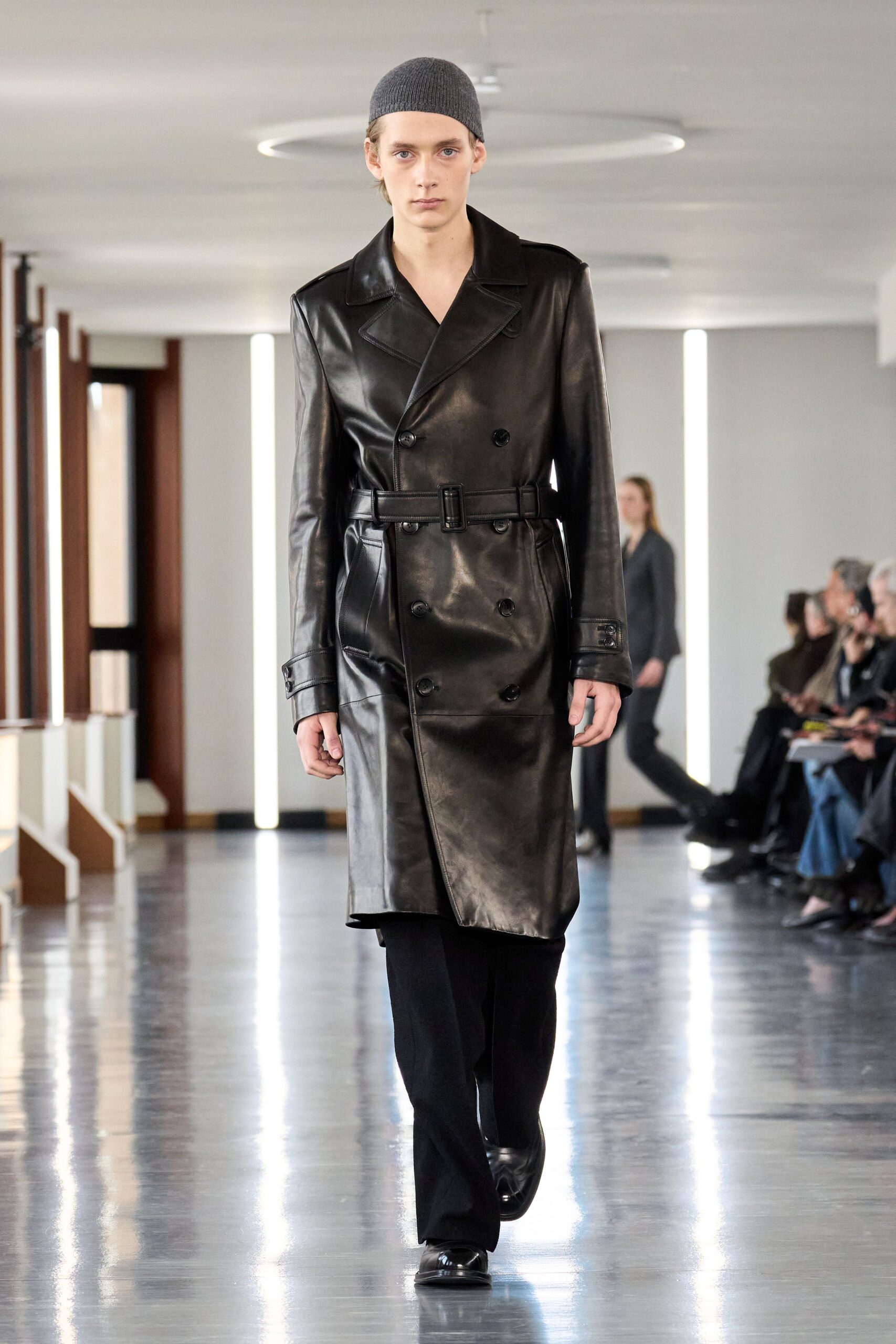 black leather coat with pants and knit hat