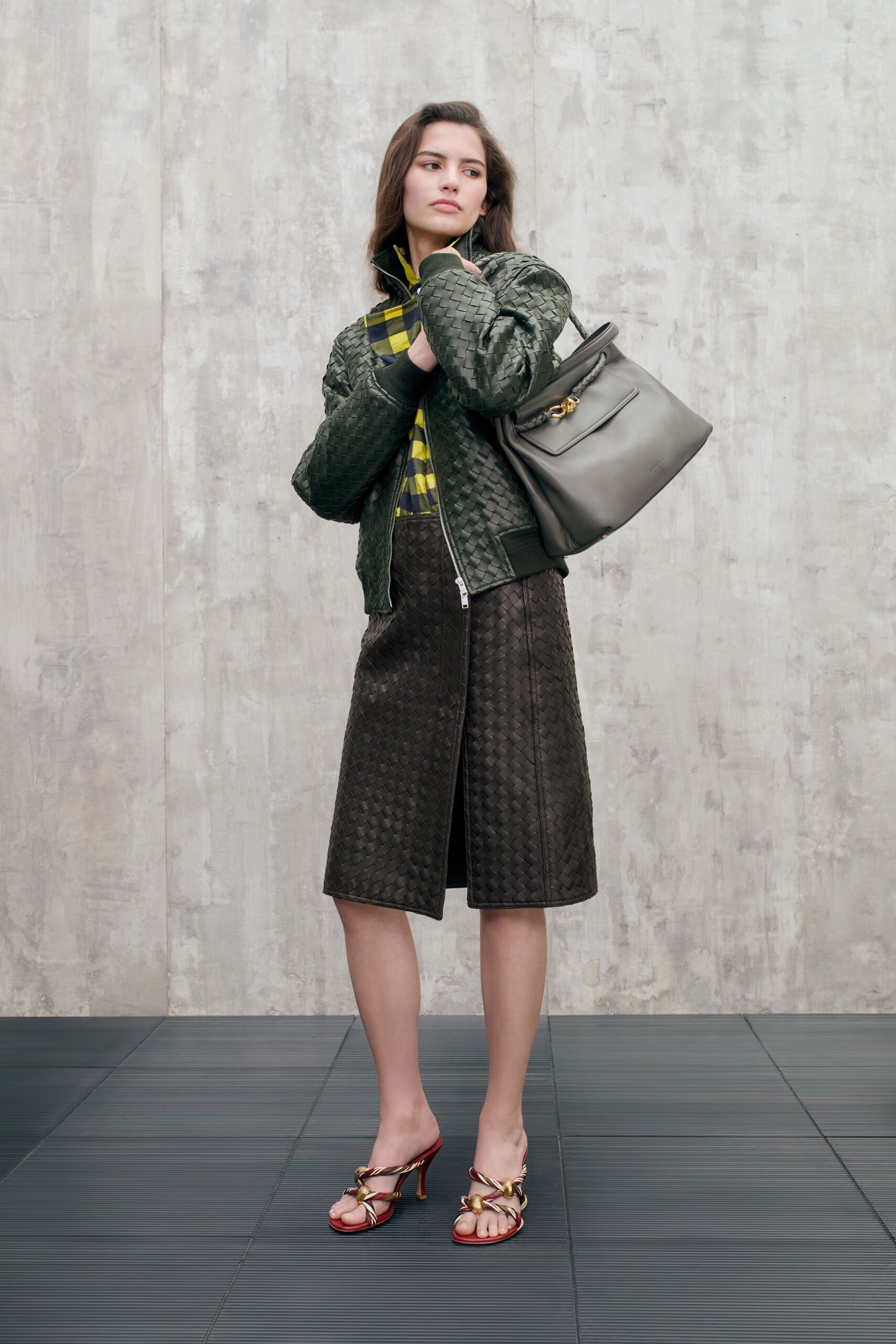 green quilted jacket with midi skirt