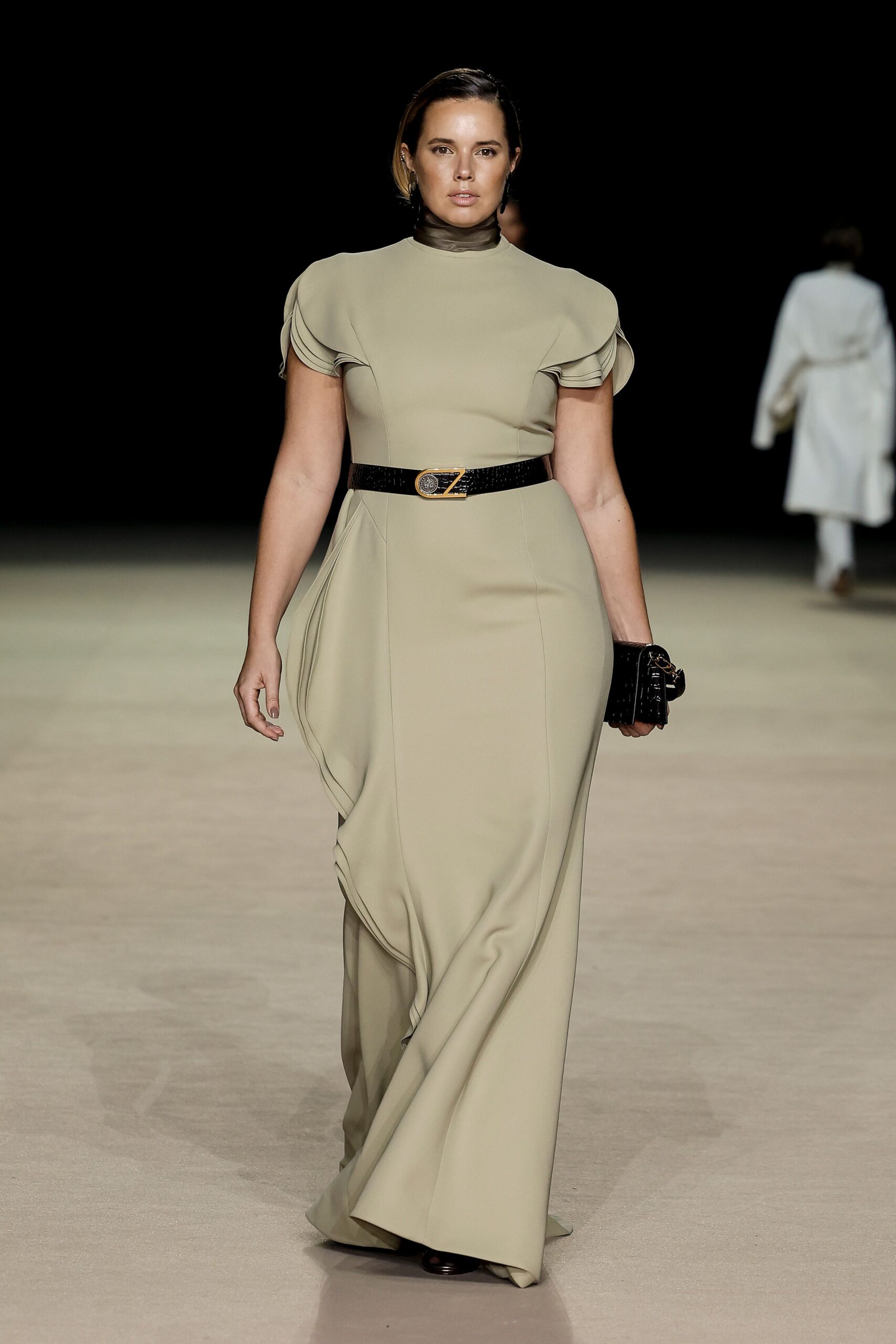 beige fitted gown with black belt