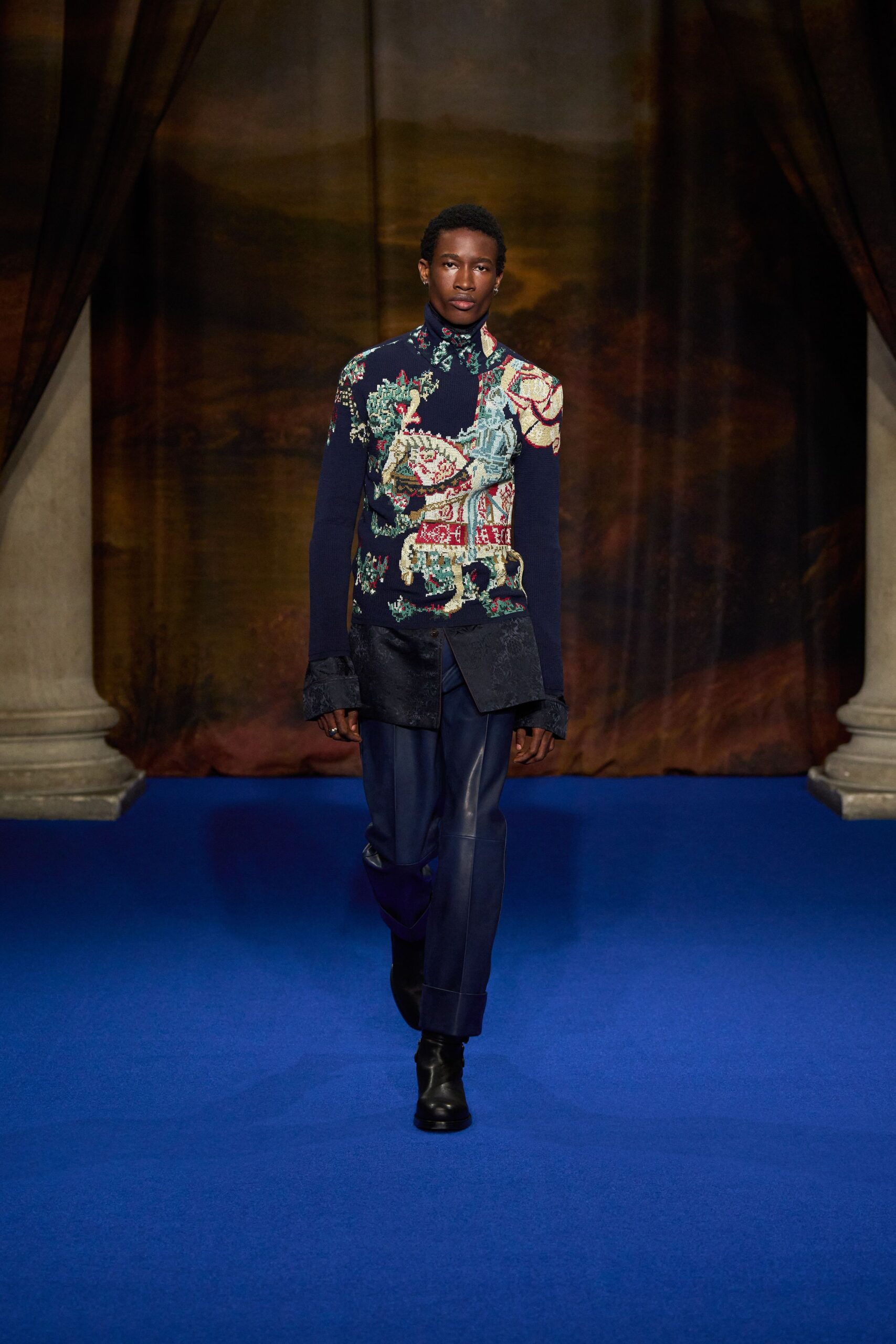 embroidered blue jacket with black pants