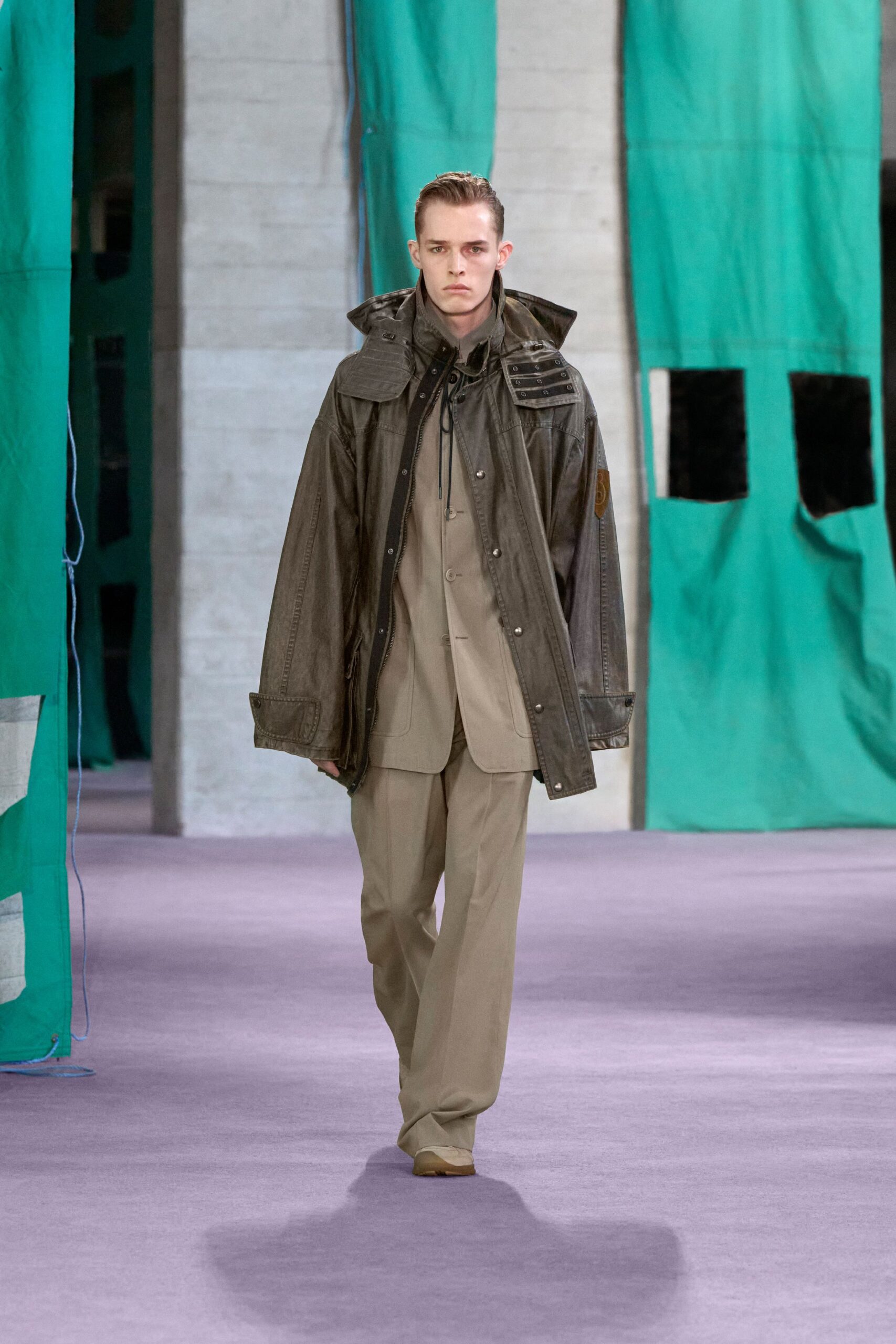 brown leather coat with beige shirt and pants