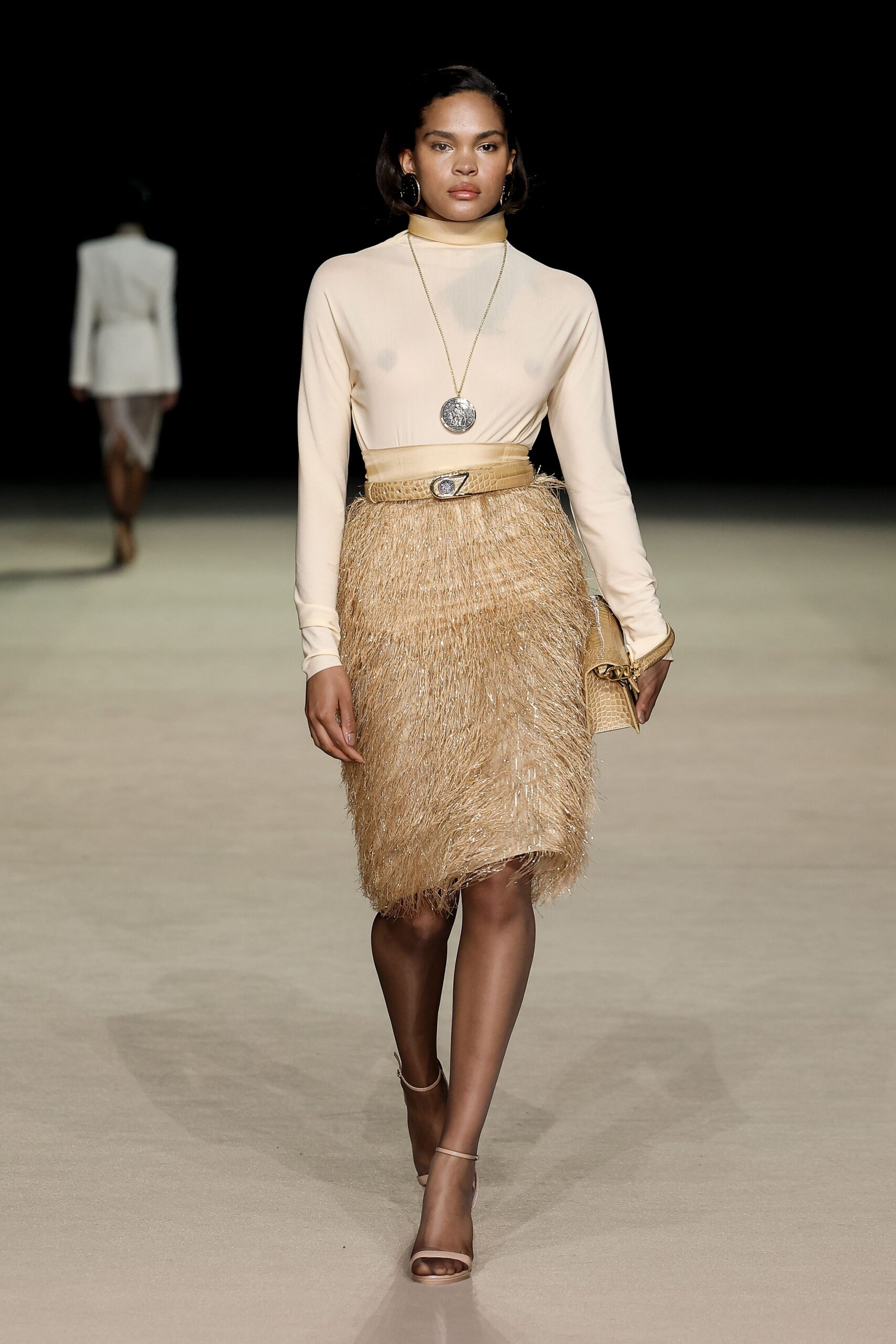 beige silk top with fringed gold skirt