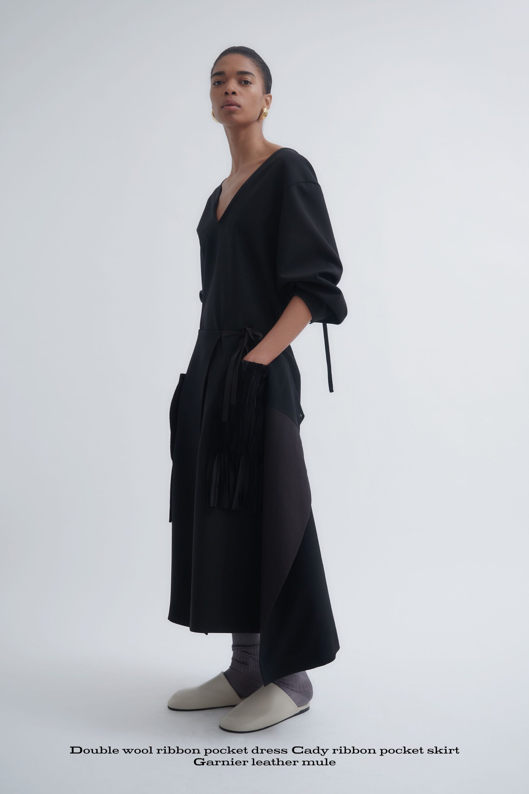 black wool long-sleeve v-neck relaxed pockets draped dress