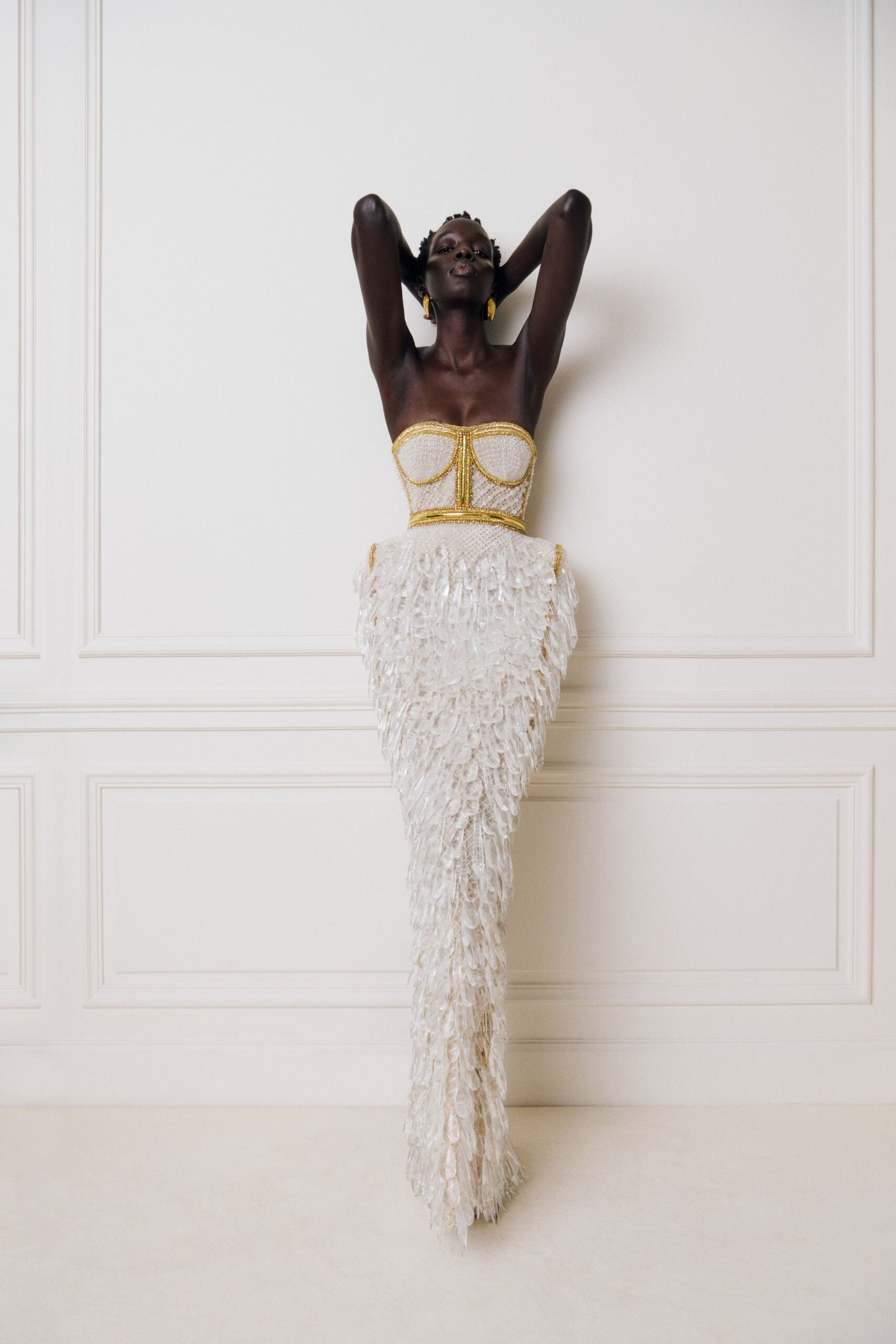 white beaded strapless gown