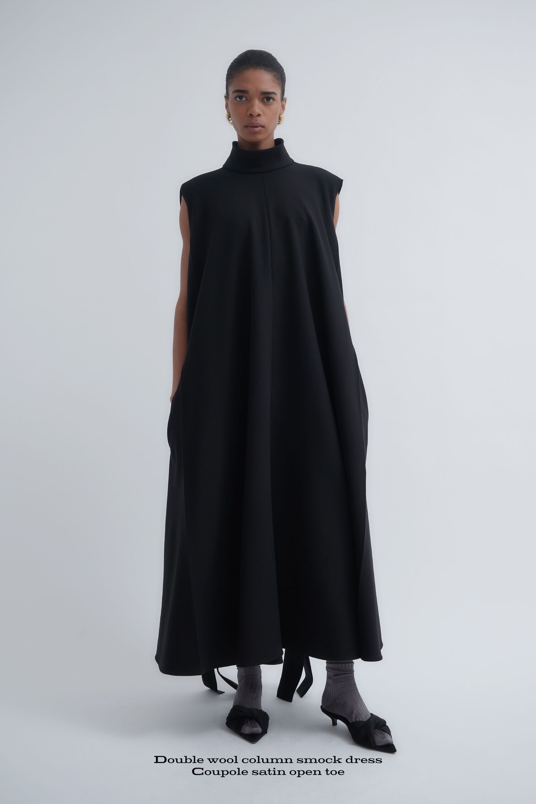 black wool sleeveless high-neck relaxed straight-leg pockets dress