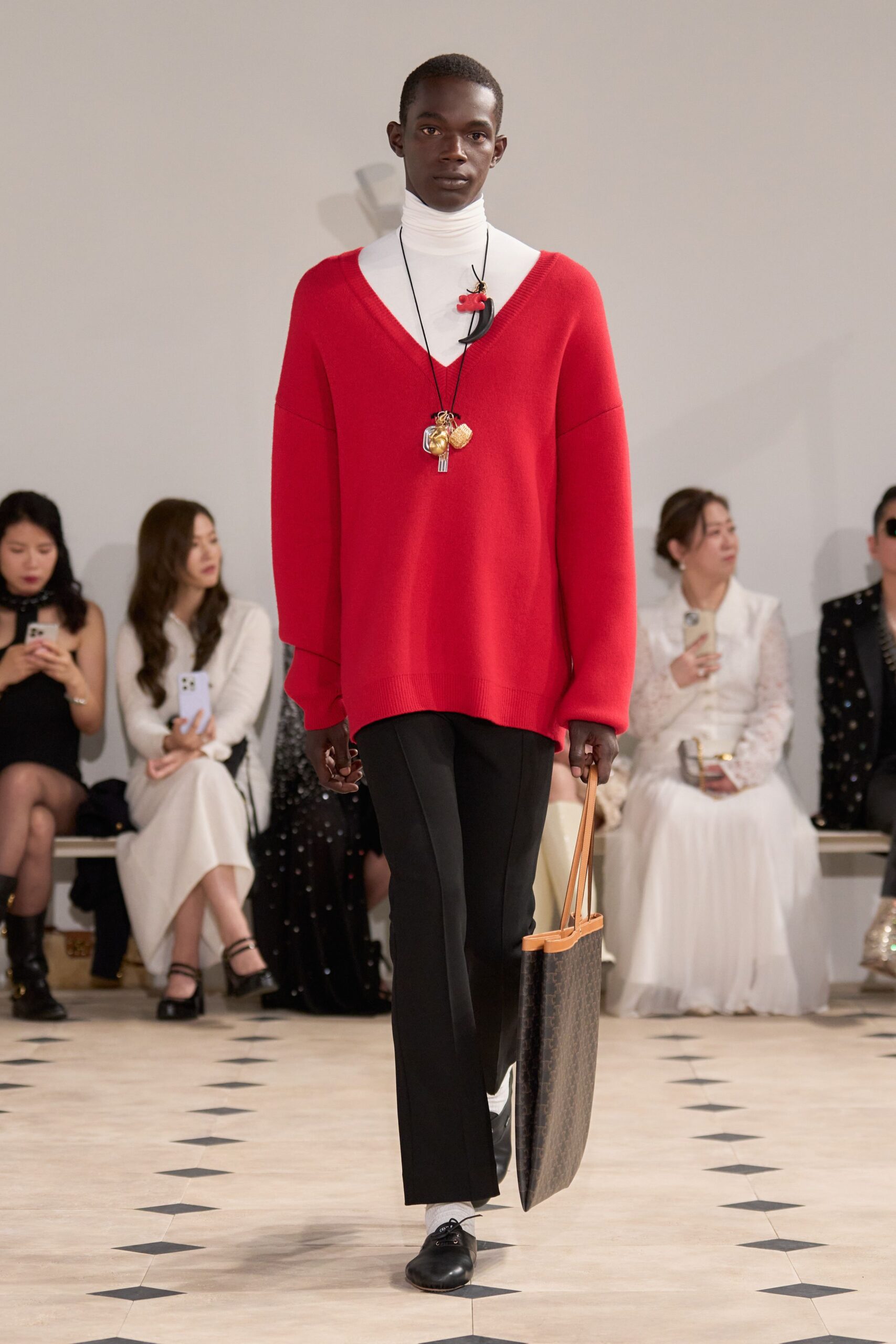 red oversized sweater with black pants