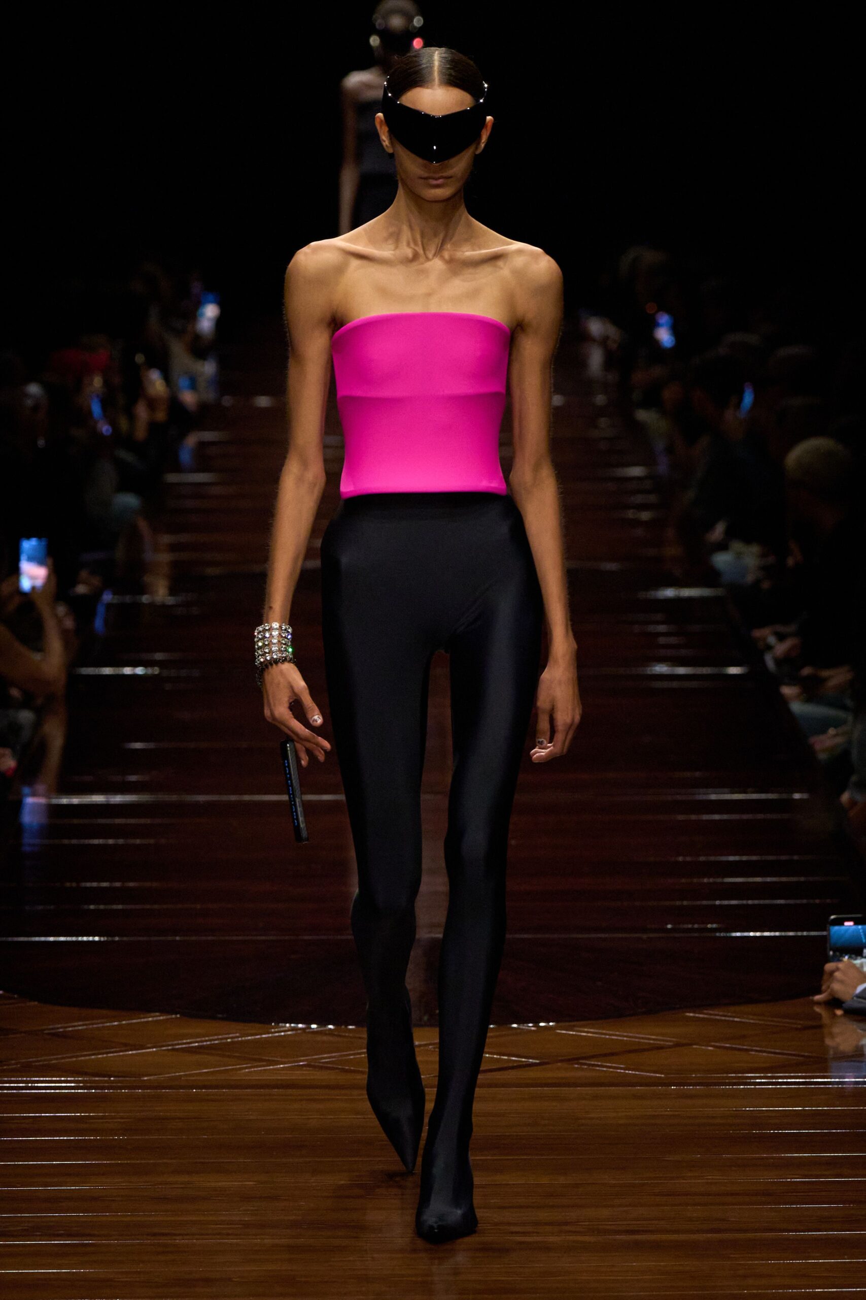 pink fitted top with black pants