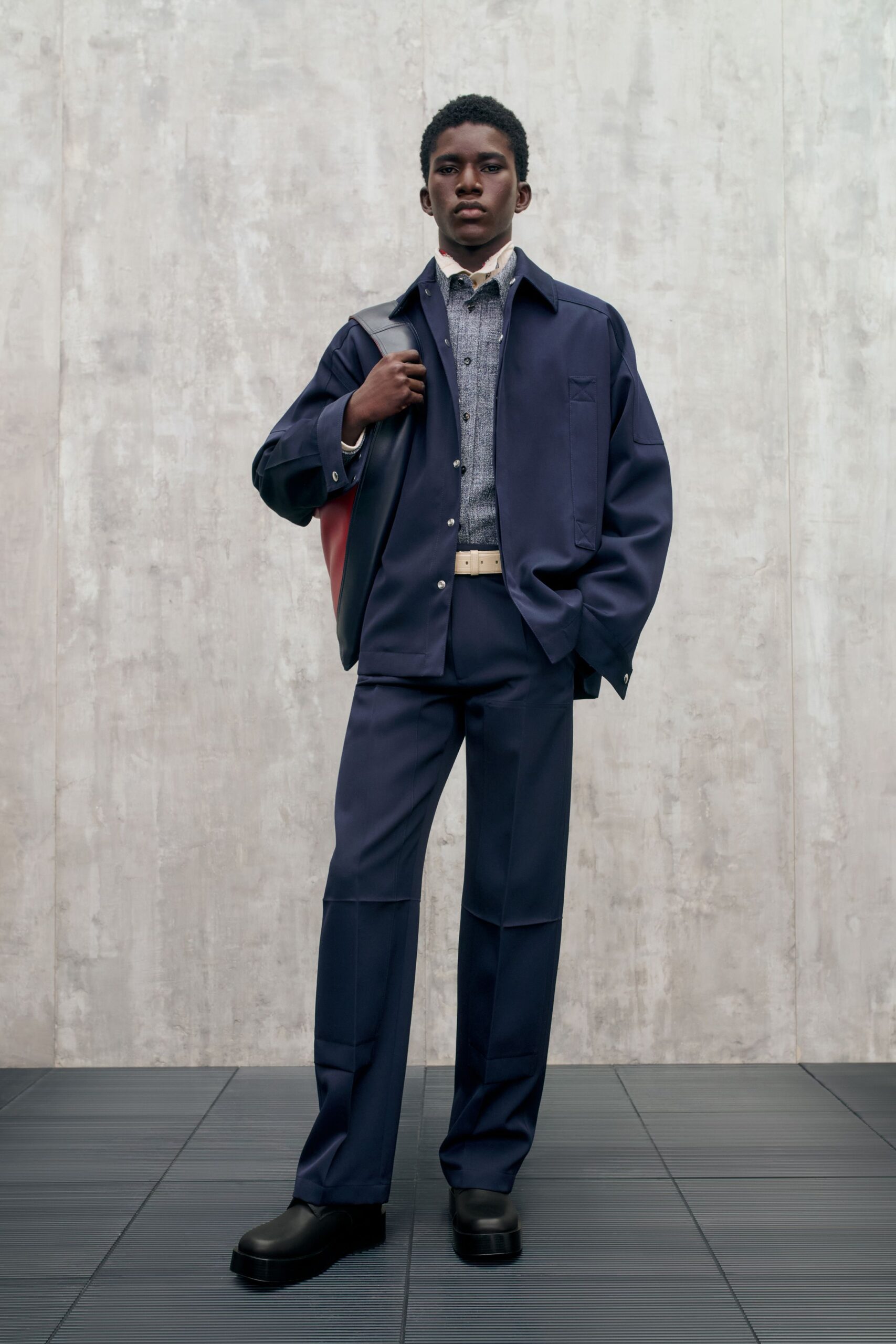 navy jacket gray shirt tailored pants