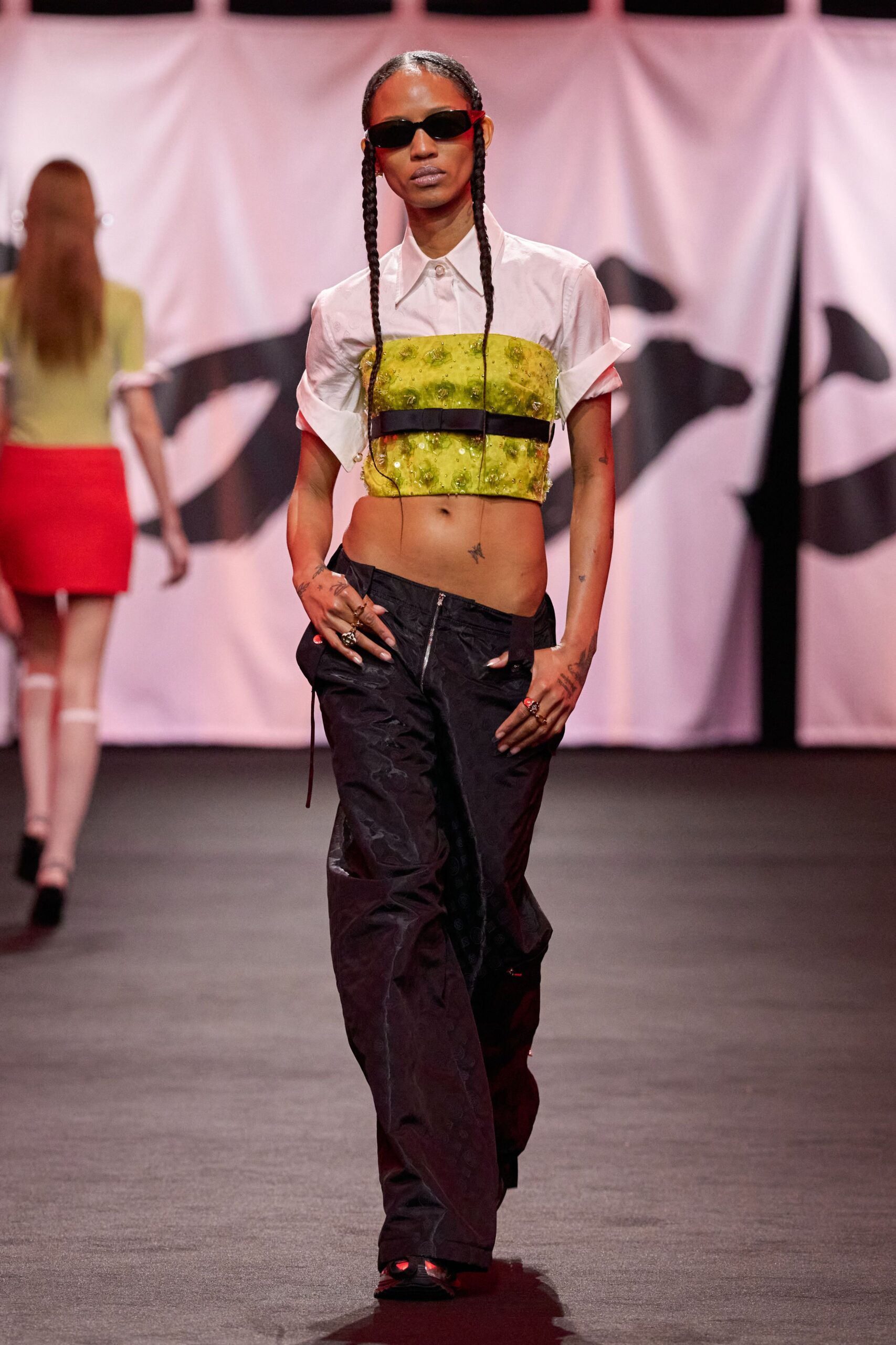 white and yellow fitted top with relaxed black pants