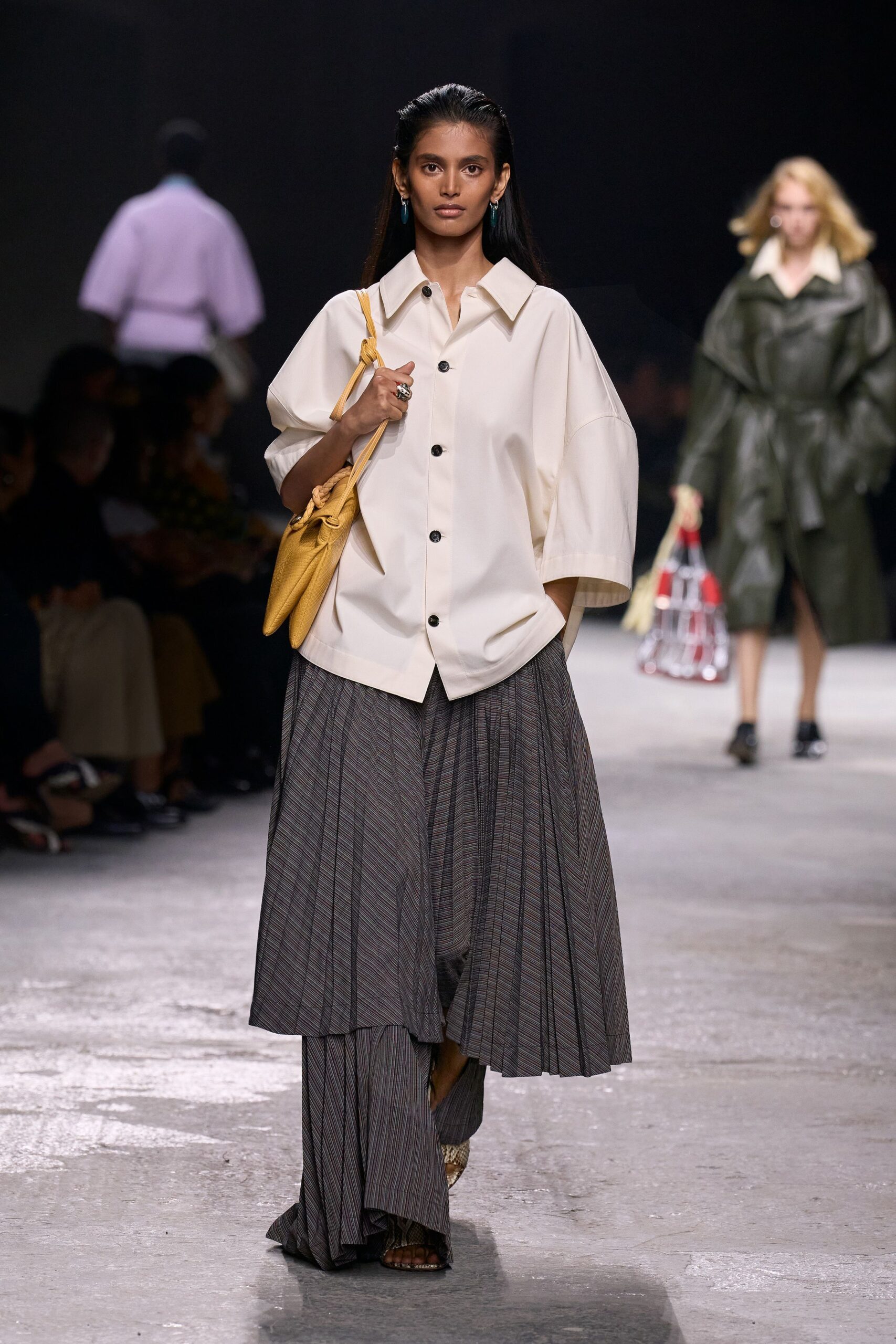 white relaxed shirt gray pleated skirt