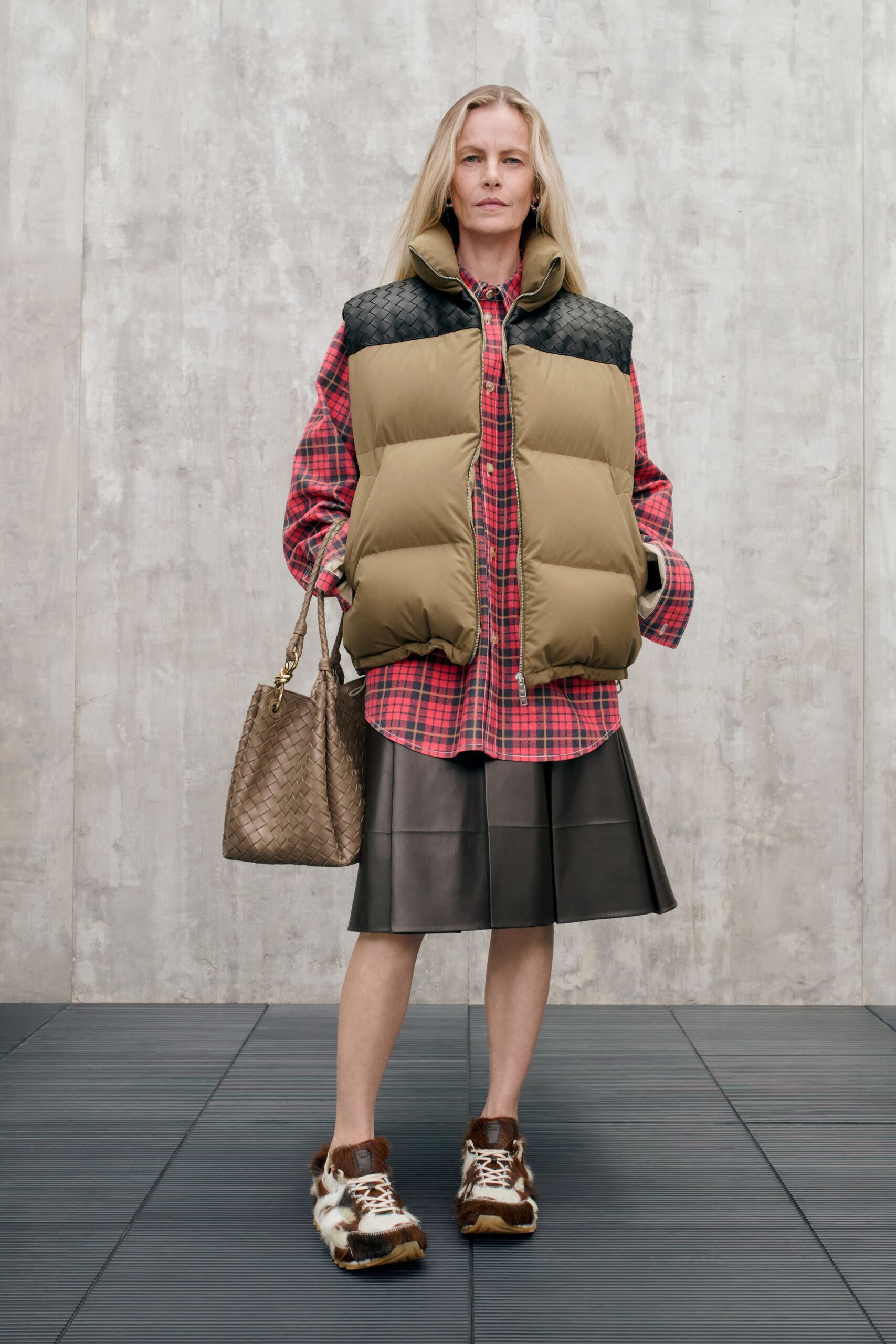 beige faux-fur vest with checked shirt